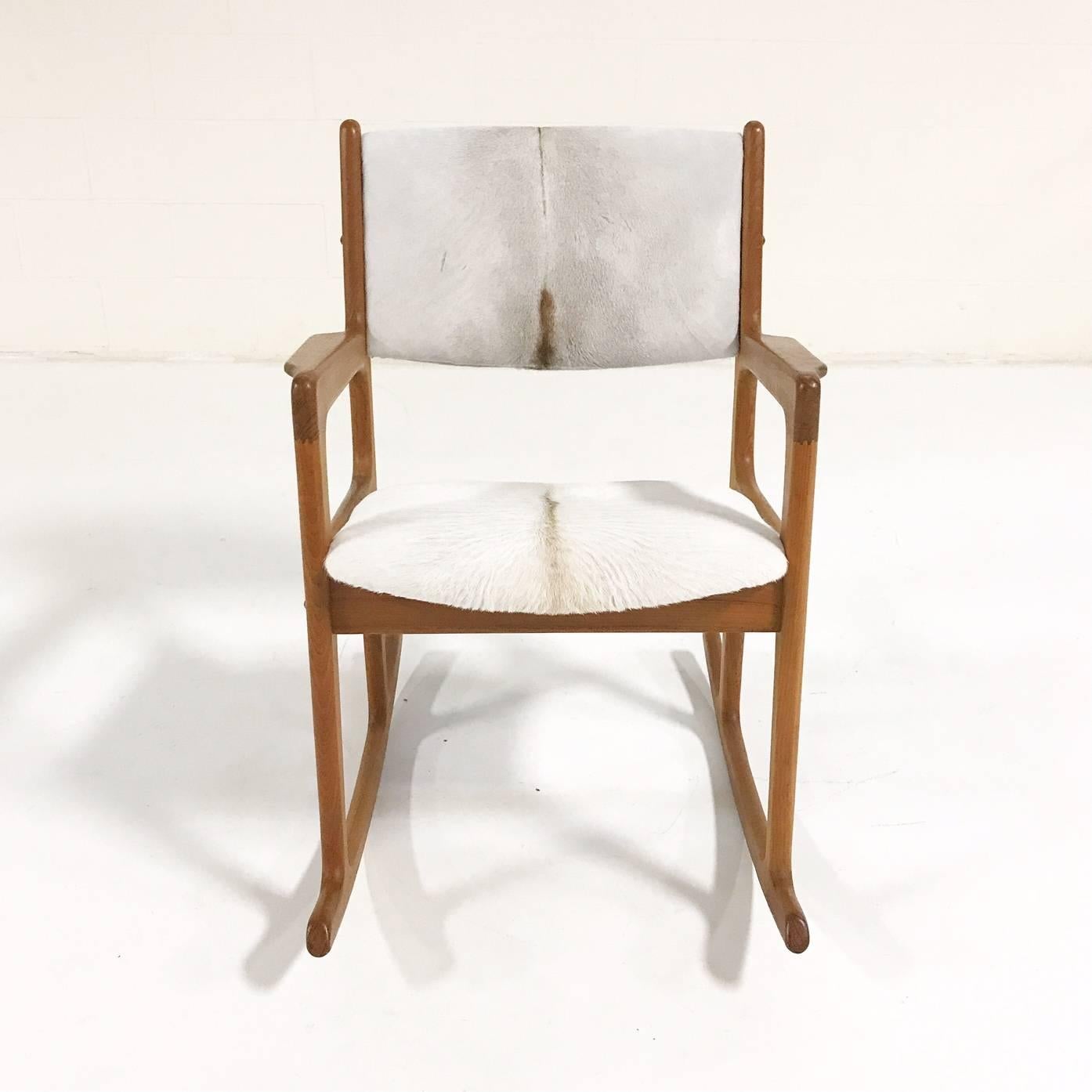 We collected this mint vintage rocking chair by great Danish designer, Benny Linden. We adored the beautifully sculpted lines solidly built teak. We restored the upholstery with our ivory hued Brazilian calfskin, the silkiest, most comfortable seat!