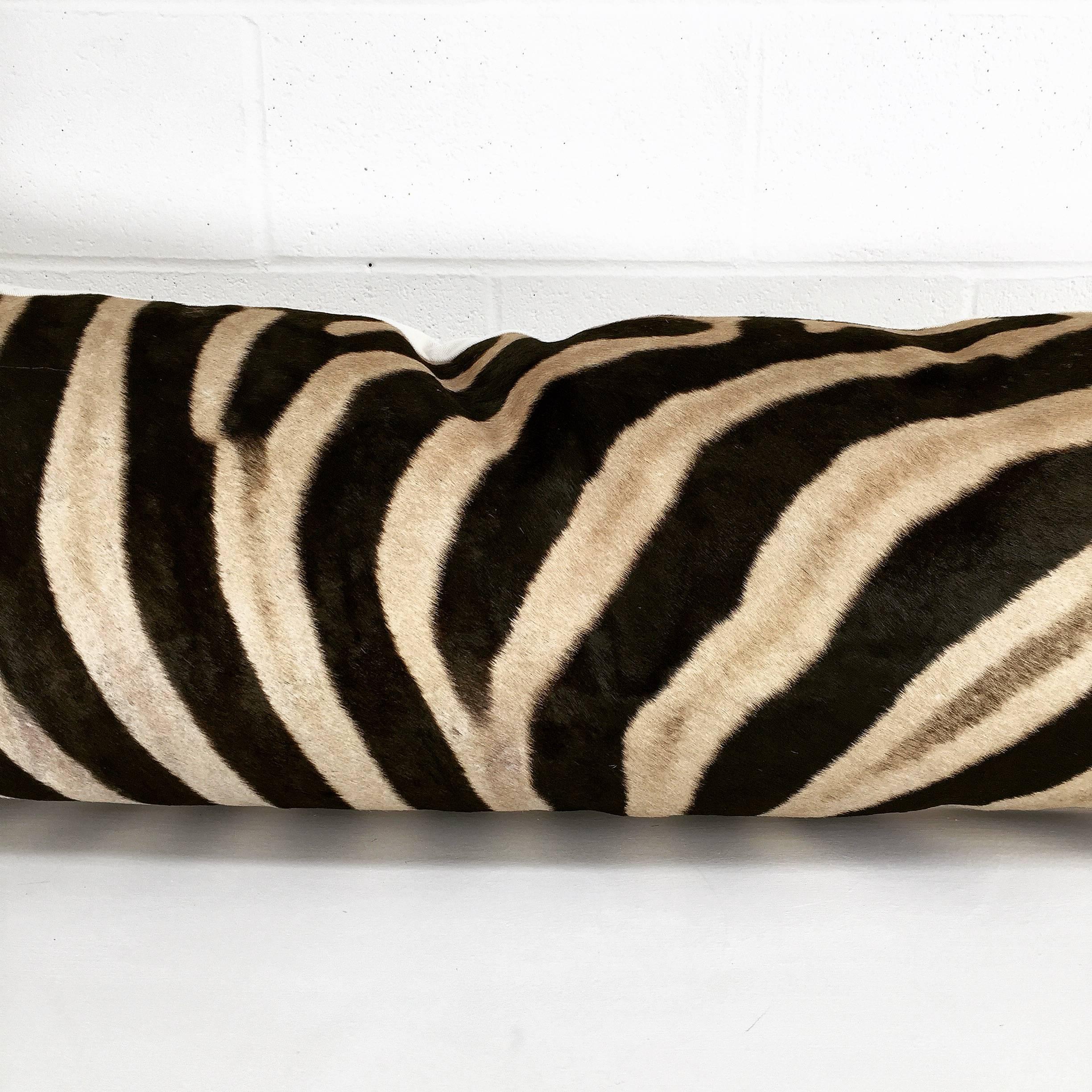 Our Luxury King Pillow makes a show-stopping statement on a couch or an incredibly luxurious feel on the bed. Our Forsyth craftsmen use a single hide for this beautiful pillow. The zebra hide is finished with our ivory cotton canvas backing and an