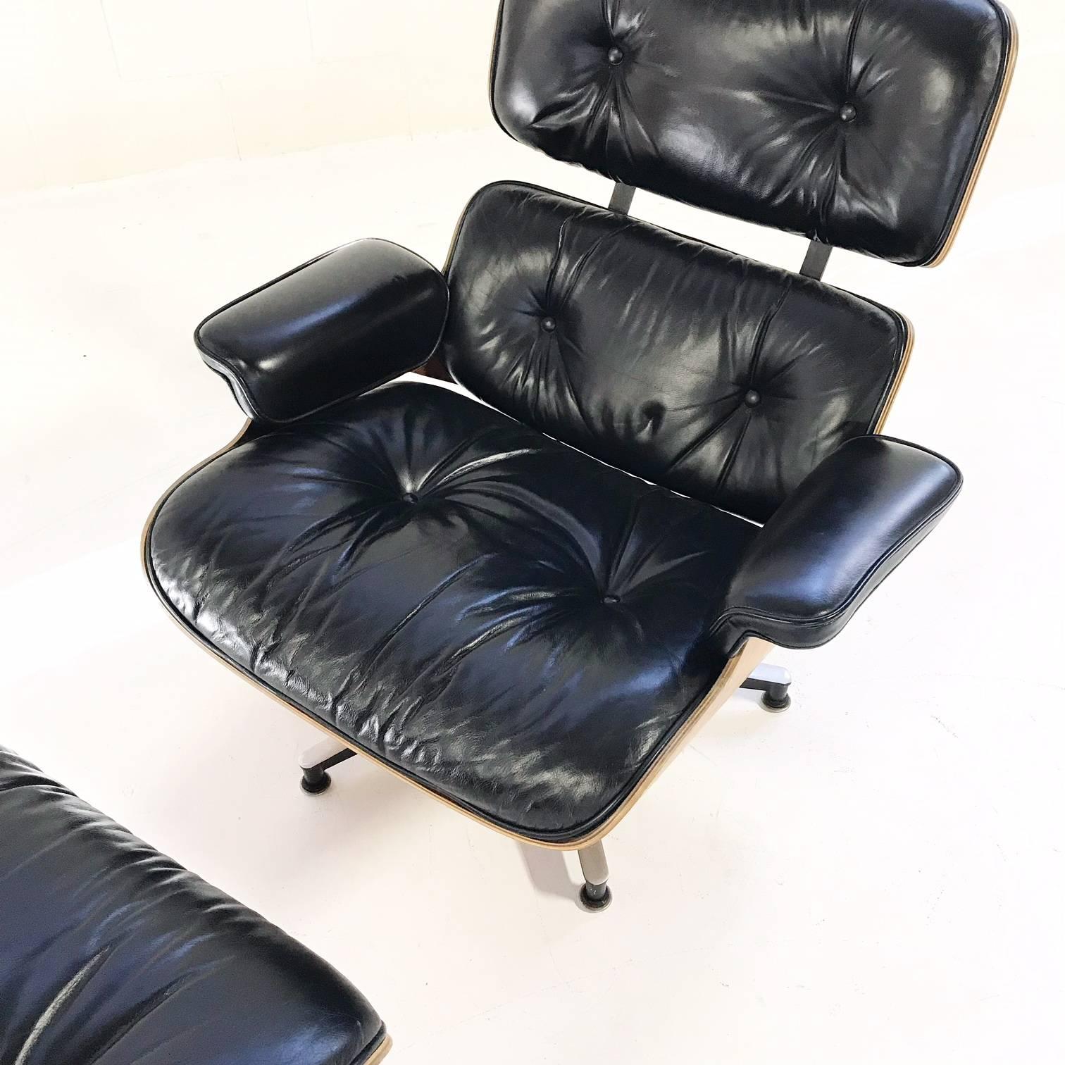 It's always on wish lists. The iconic Eames lounge and ottoman. This one is in excellent condition. The black leather is flawless, the walnut is lovely, and the enameled metal shows no signs of wear. Manufacturer's label is underneath. 

Charles