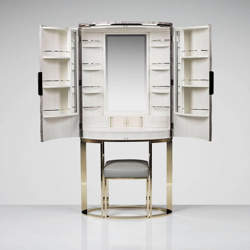 Designed to aid the finishing touches of getting ready, the sophisticated cabinet opens to reveal an array of shelves, drawers and compartments for storing jewellery, make up, hair brushes and perfume bottles as well as a large mirror to ensure the