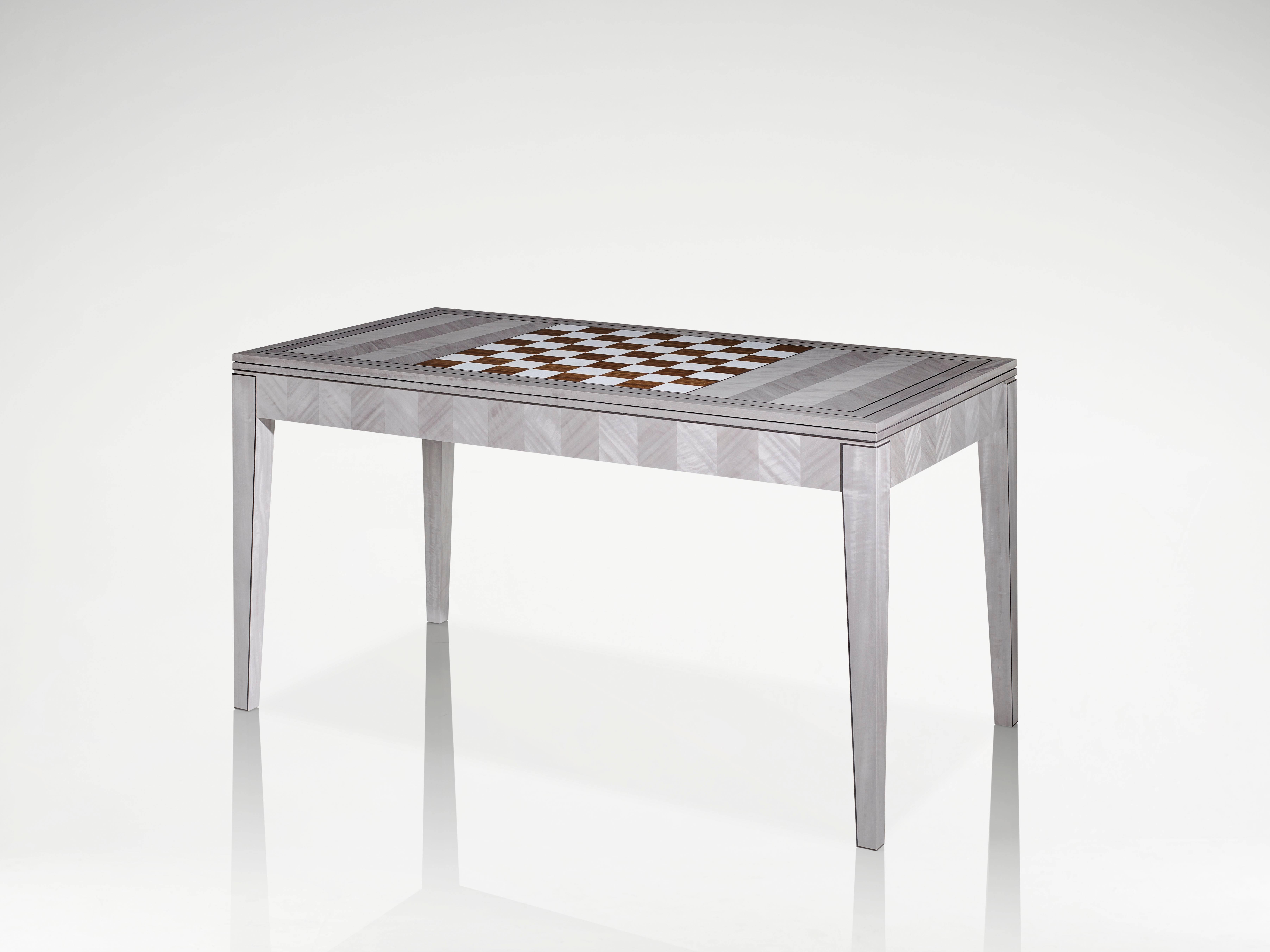 Known for it’s elegant symmetry and integrity of pattern, the beautiful new Herringbone patterned games table is a brilliant piece of marquetry that combines function, form, and fun in Classic Linley style.

The Herringbone games table has been