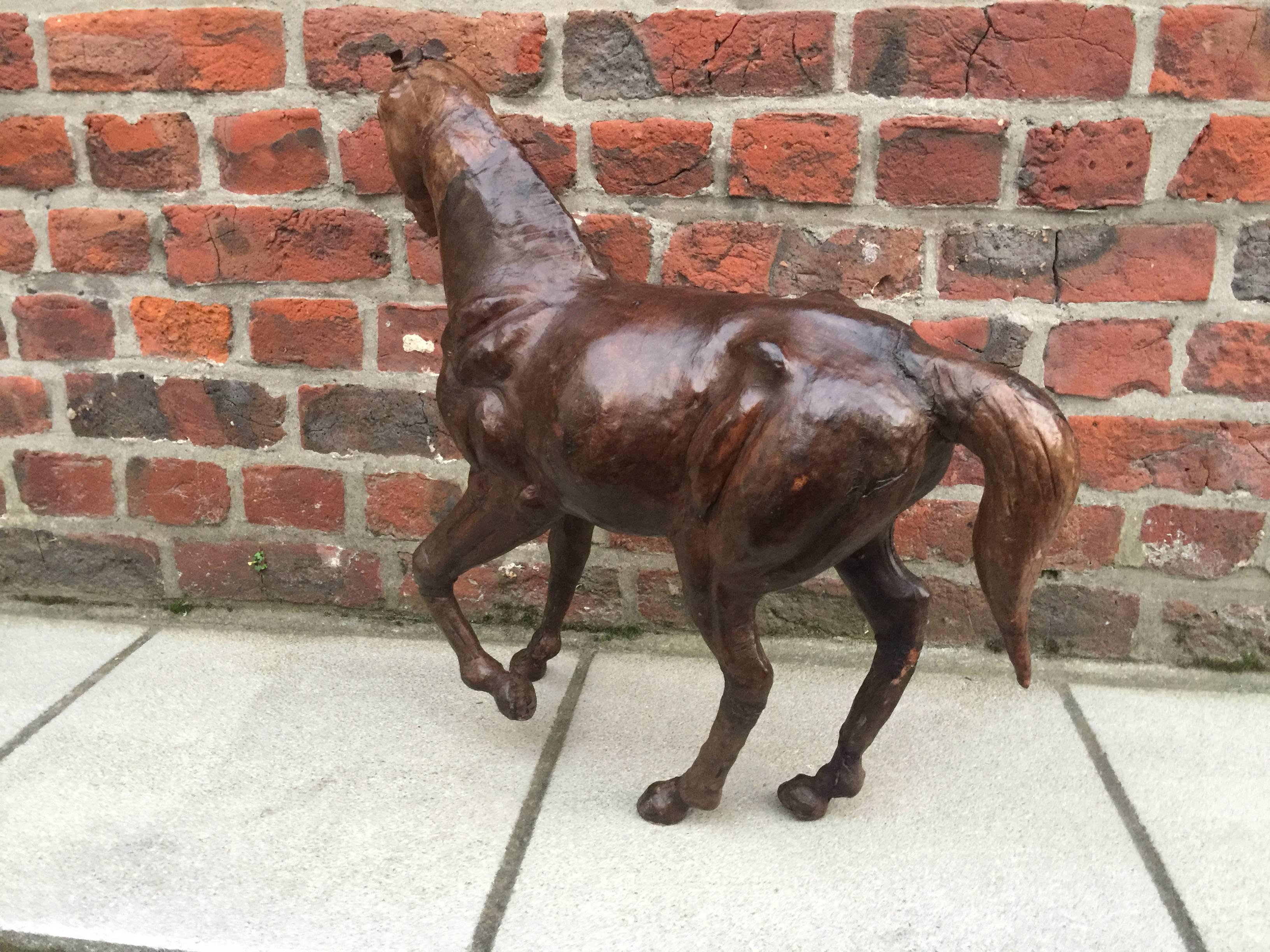 Sculpture sheathed of leather representing a horse.