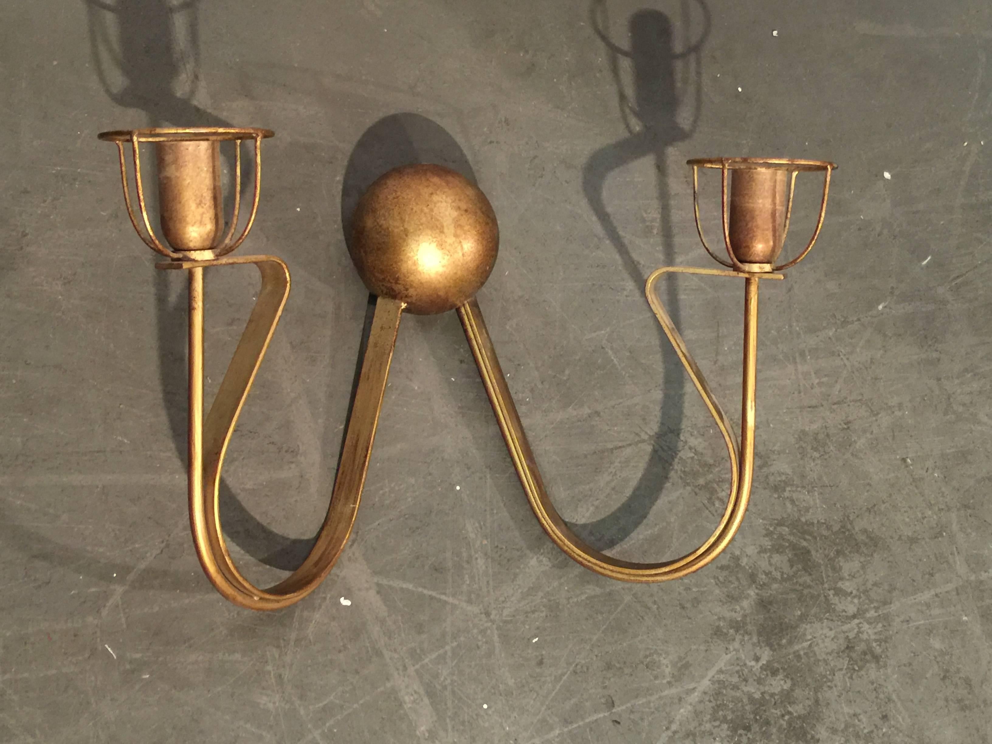 Pair of gilt metal sconces in the style of, circa 1970.