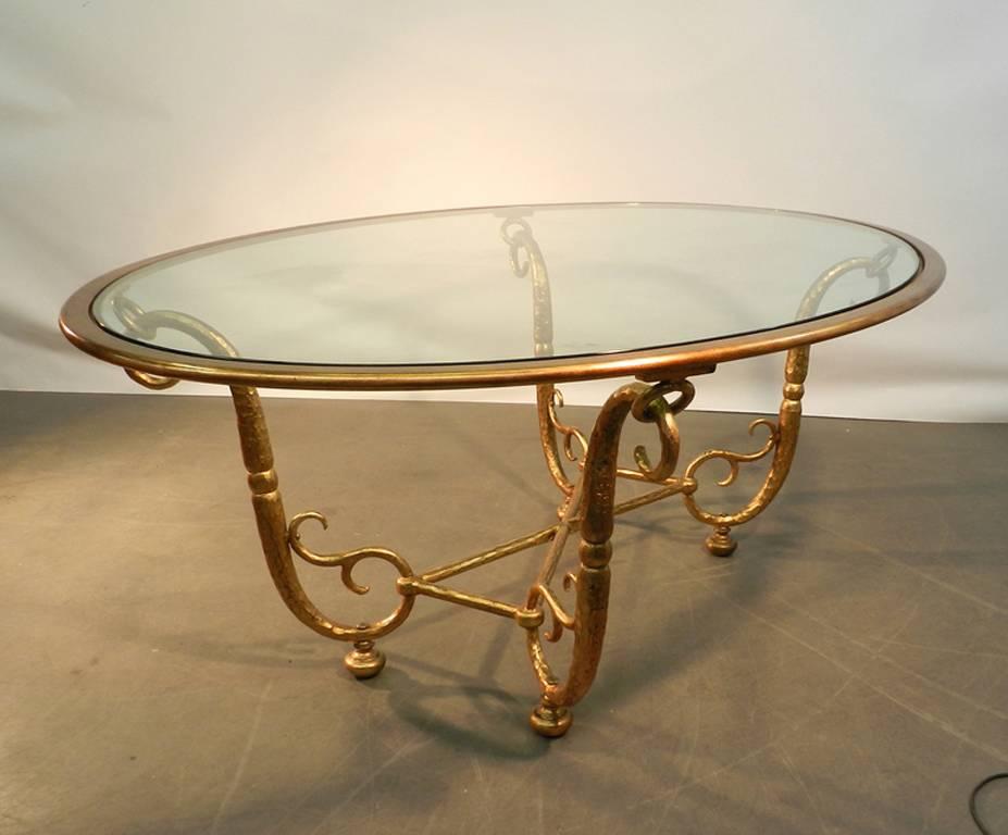 Italian work. Large golden iron and glass dining room table 