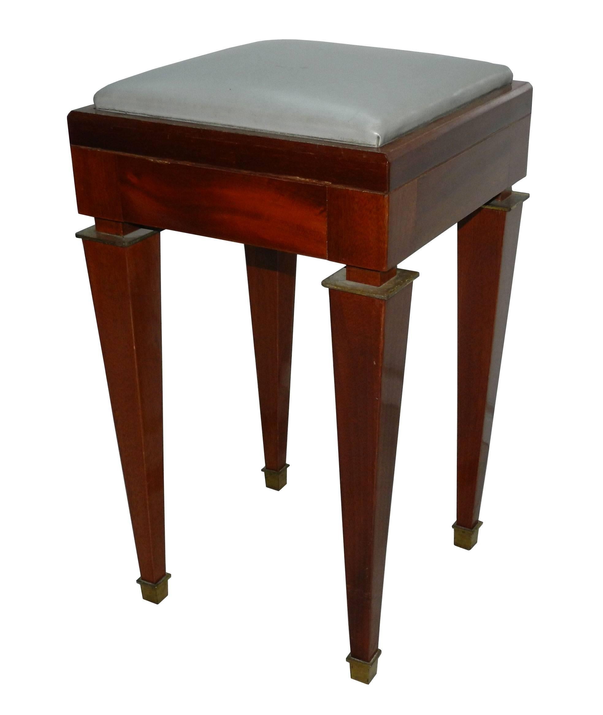 Unsual stools in mahogany with brass feet 