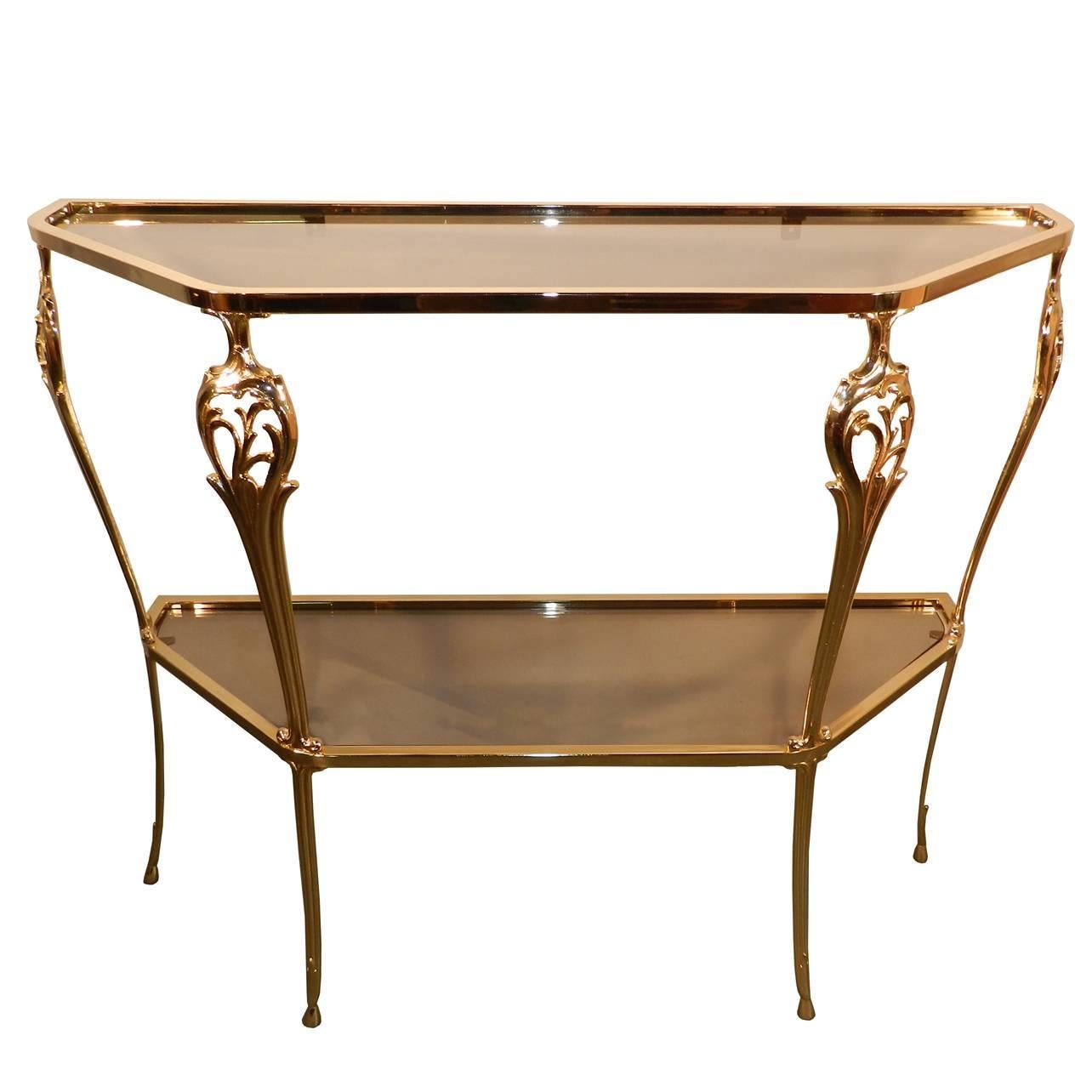 Neo Baroque gilt metal console and its mirror, circa 1980.
Dimensions en cm:
Height 70 / 78.
width 110 / 96.
depth 32.
 