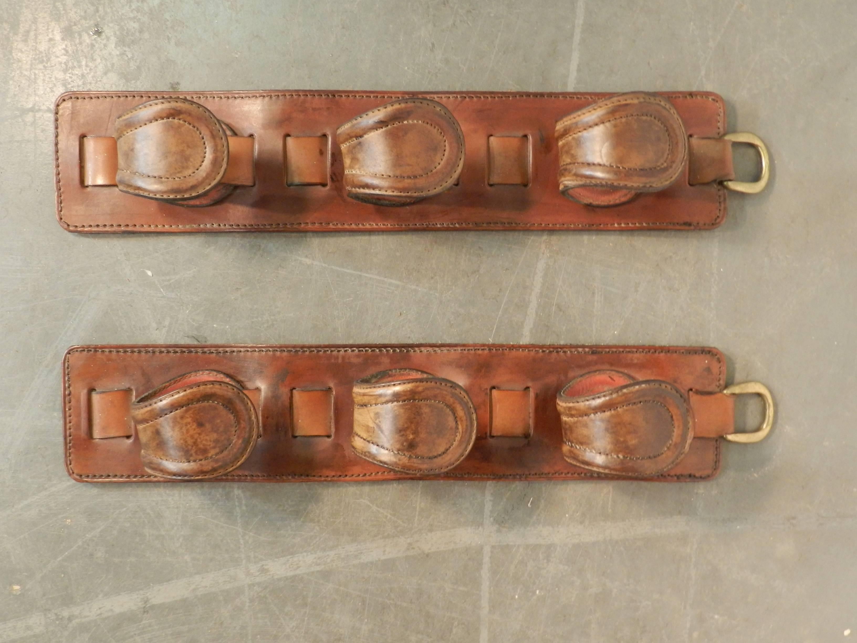 Patinated Pair of Gun Racks in Leather in the Style of Jacques Adnet, circa 1950