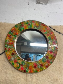 Vintage circulat mirror with a polychrome glass mosaic frame