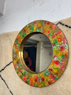 Vintage circulat mirror with a polychrome glass mosaic frame