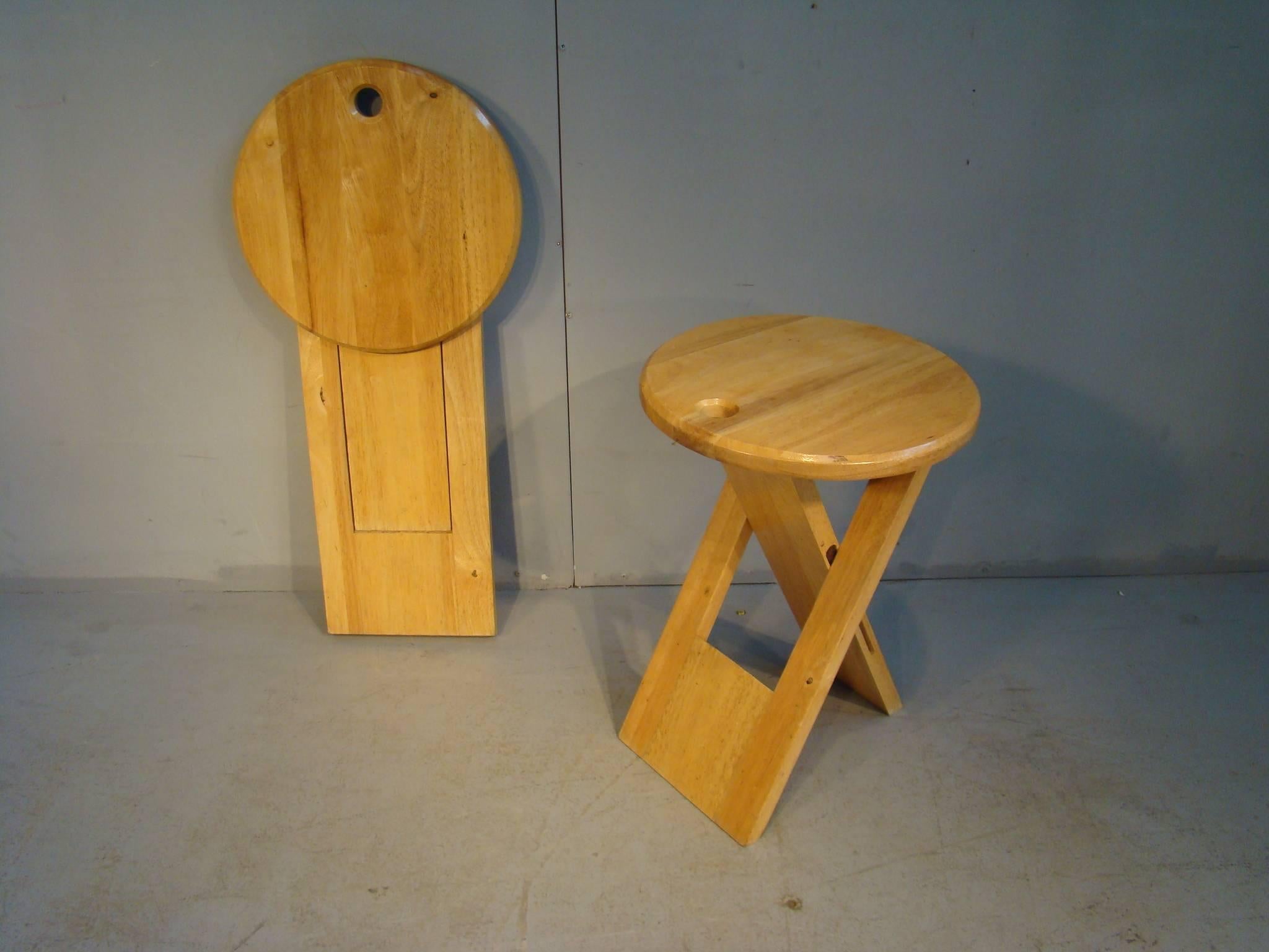 Set of six foldable stools, in maple, by Roger Tallon for Sentou, France, 1970s. 

Ingeniously designed retractable stools. Set of four maple stools, which can easily be placed and fold up.