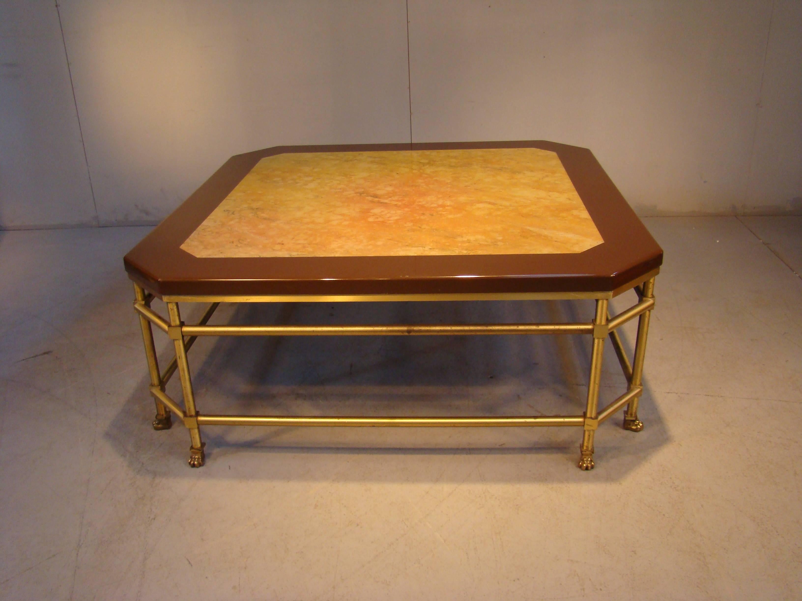 Maison Jansen, coffee table, circa 1970.
Brass leg, marble imitation in resin on the top.
  
