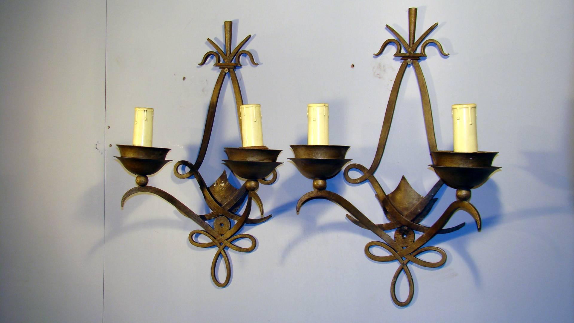 Pair of Art Deco Poillerat style wall sconces, French, 1940s in wrought iron.