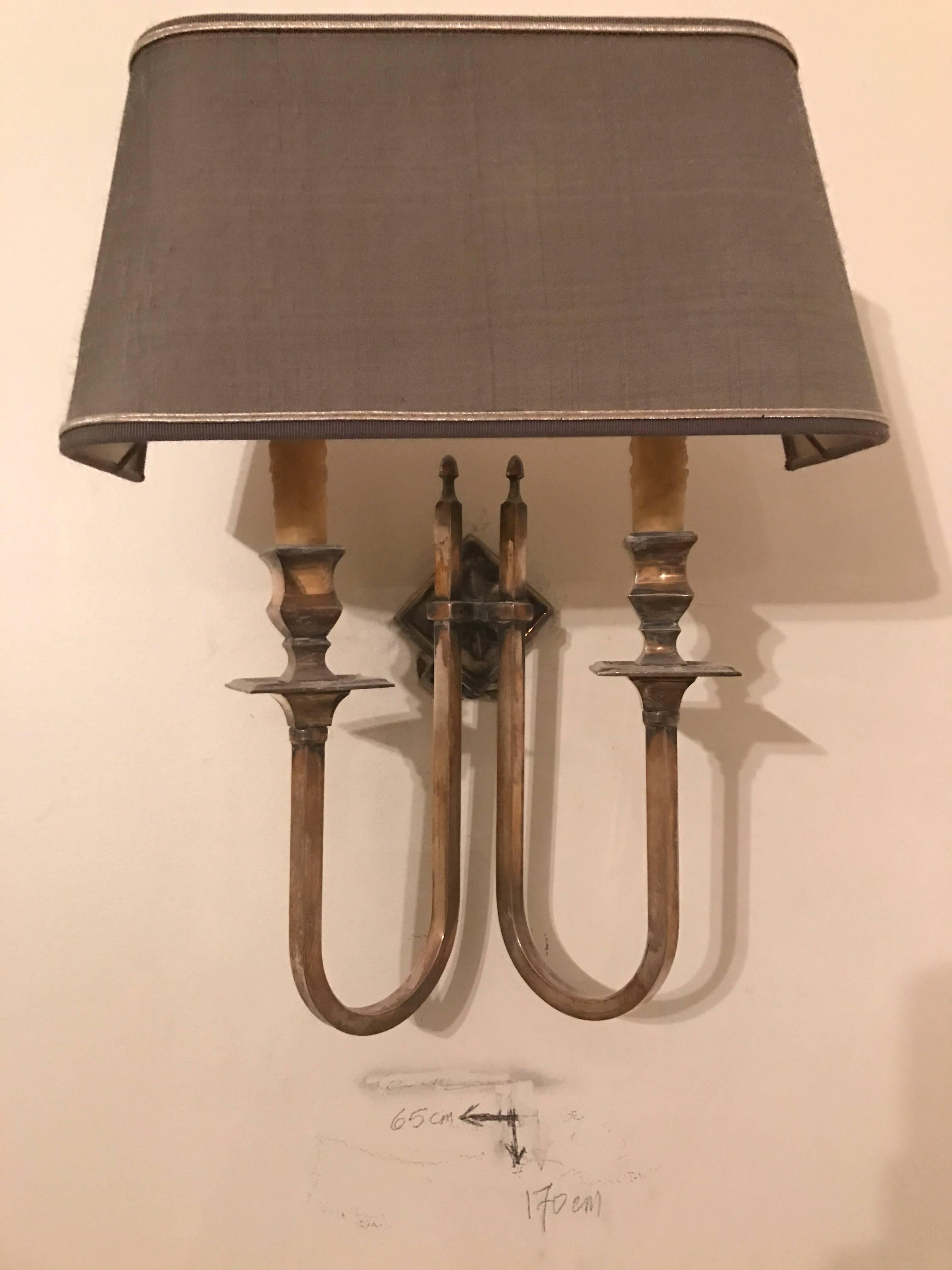 Pair of silver plate sconces with half Luna shade in the style of Maison Jansen.