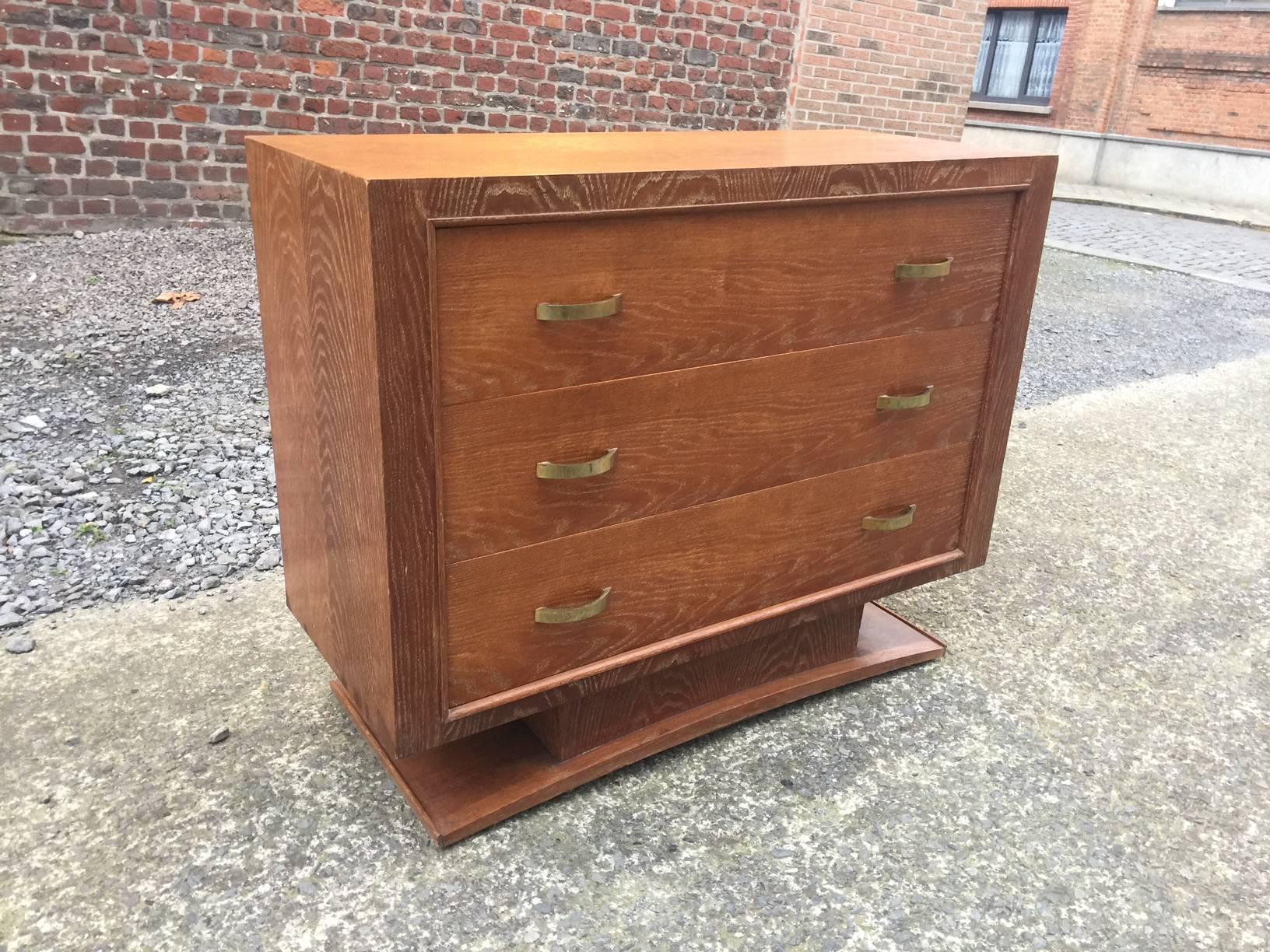 Jacques Adnet style of Art Deco oak chest of drawers, circa 1940s. 
Stamp not decipher.
