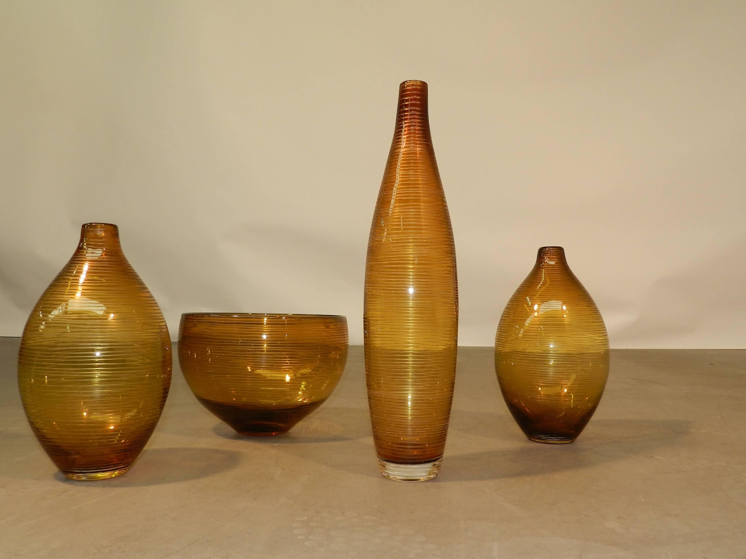 Set of four 1960 glasswares, Scandinavian style.
Measures: Height 17/28/17/43 cm,
diameter 23 cm.