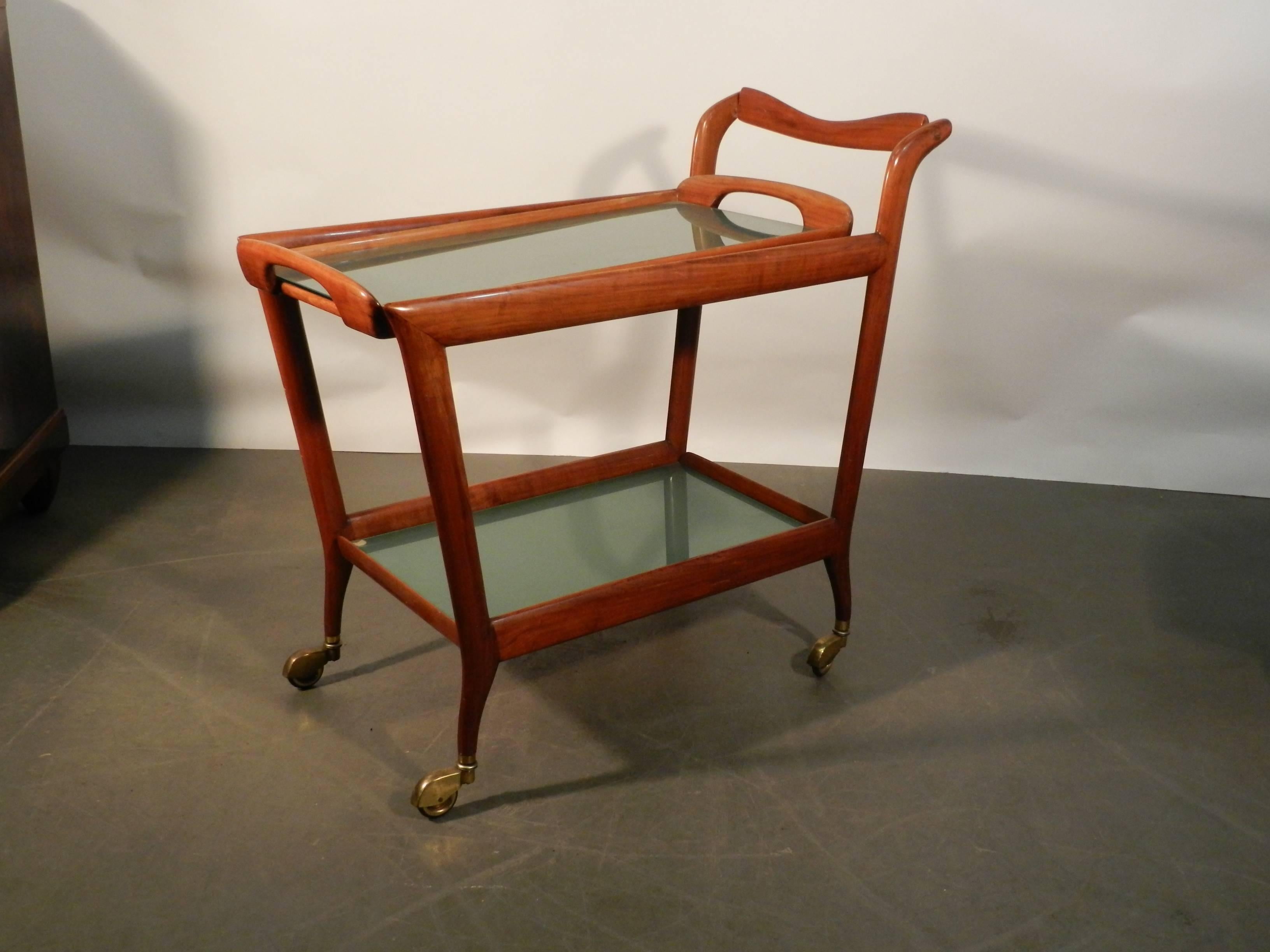 Ico Parisi (attributed to), wood and blue-toned glass trolley, Italy, 1950.
Removable tray on the top.