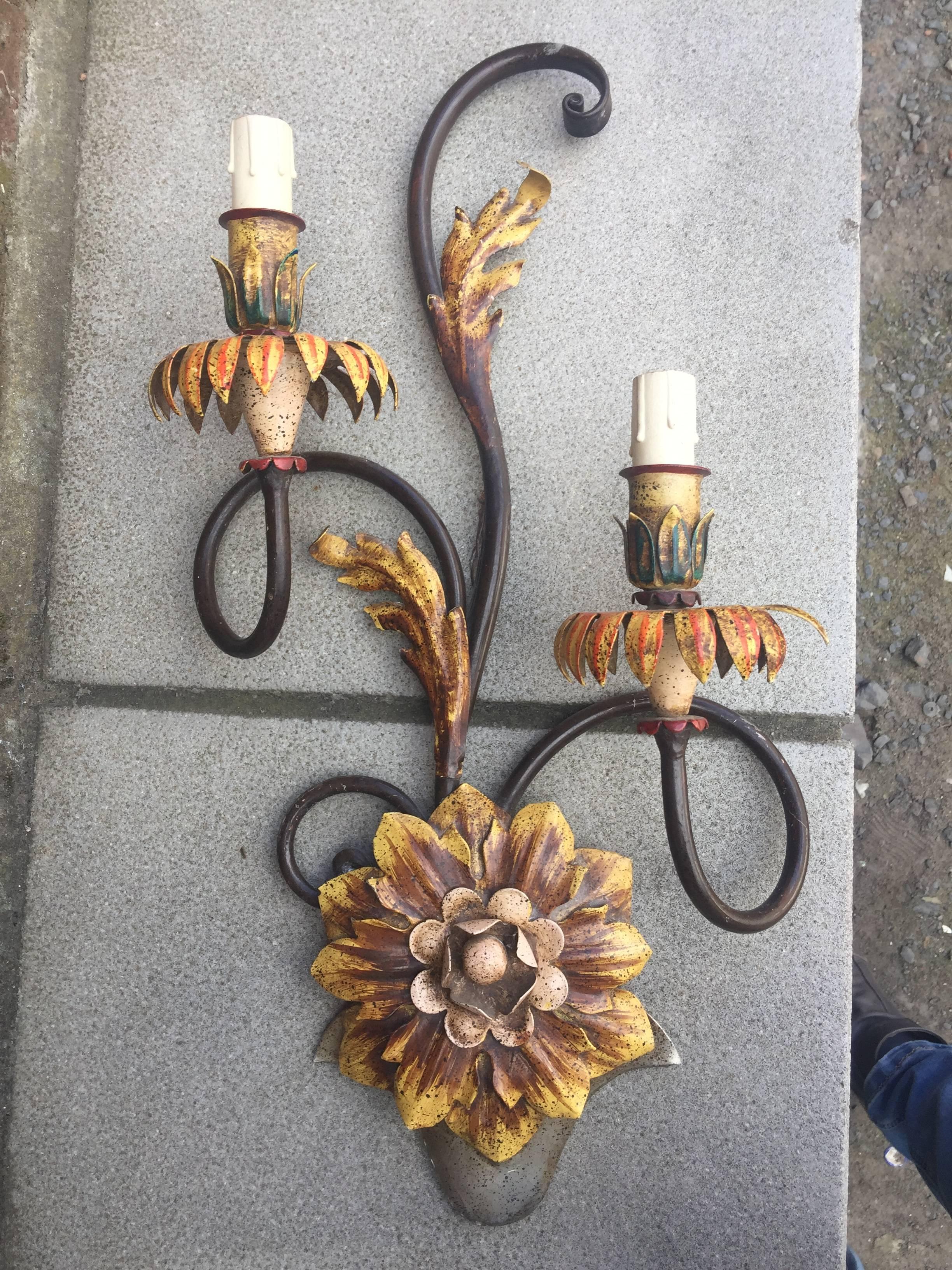 Set of nine lacquered wrought iron sconces with two lights
Neoromantic style, circa 1970.
Part of an important set including a twelve lights chandelier and three sconces with five lights.