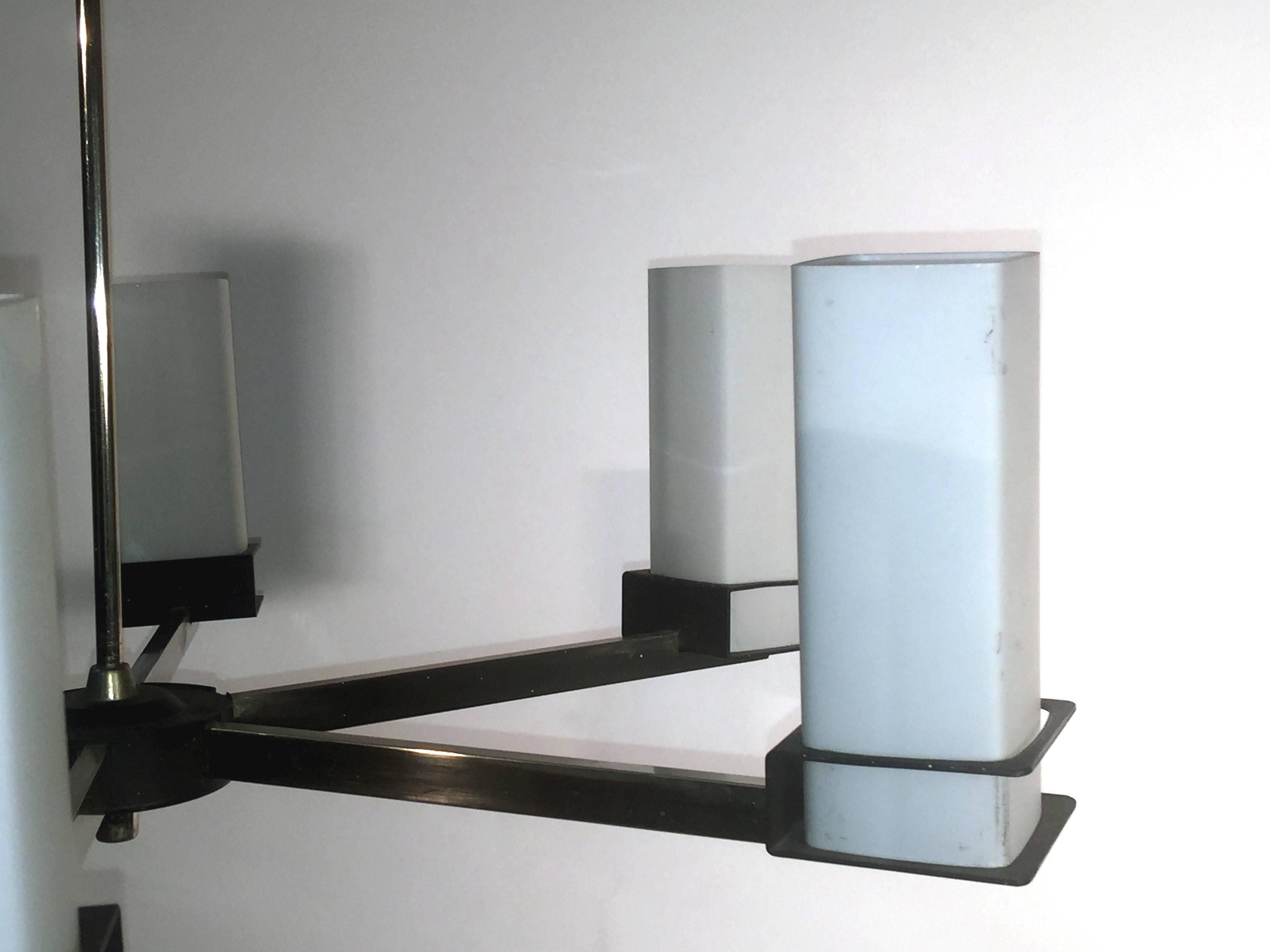 two 1960s metal, chrome and opaline glass pendants.