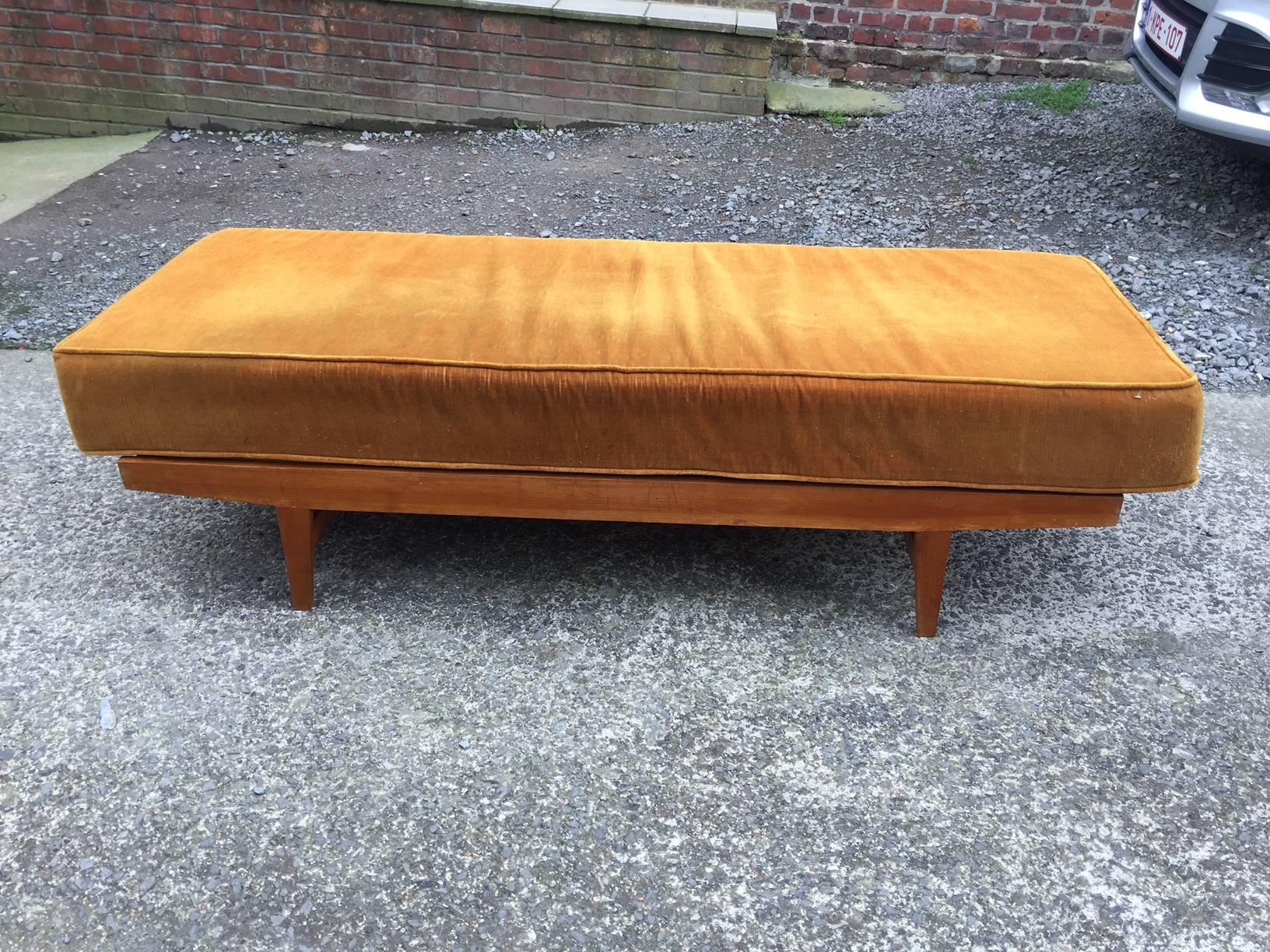 1950s daybed in pine, seat and cushion covered with velvet.