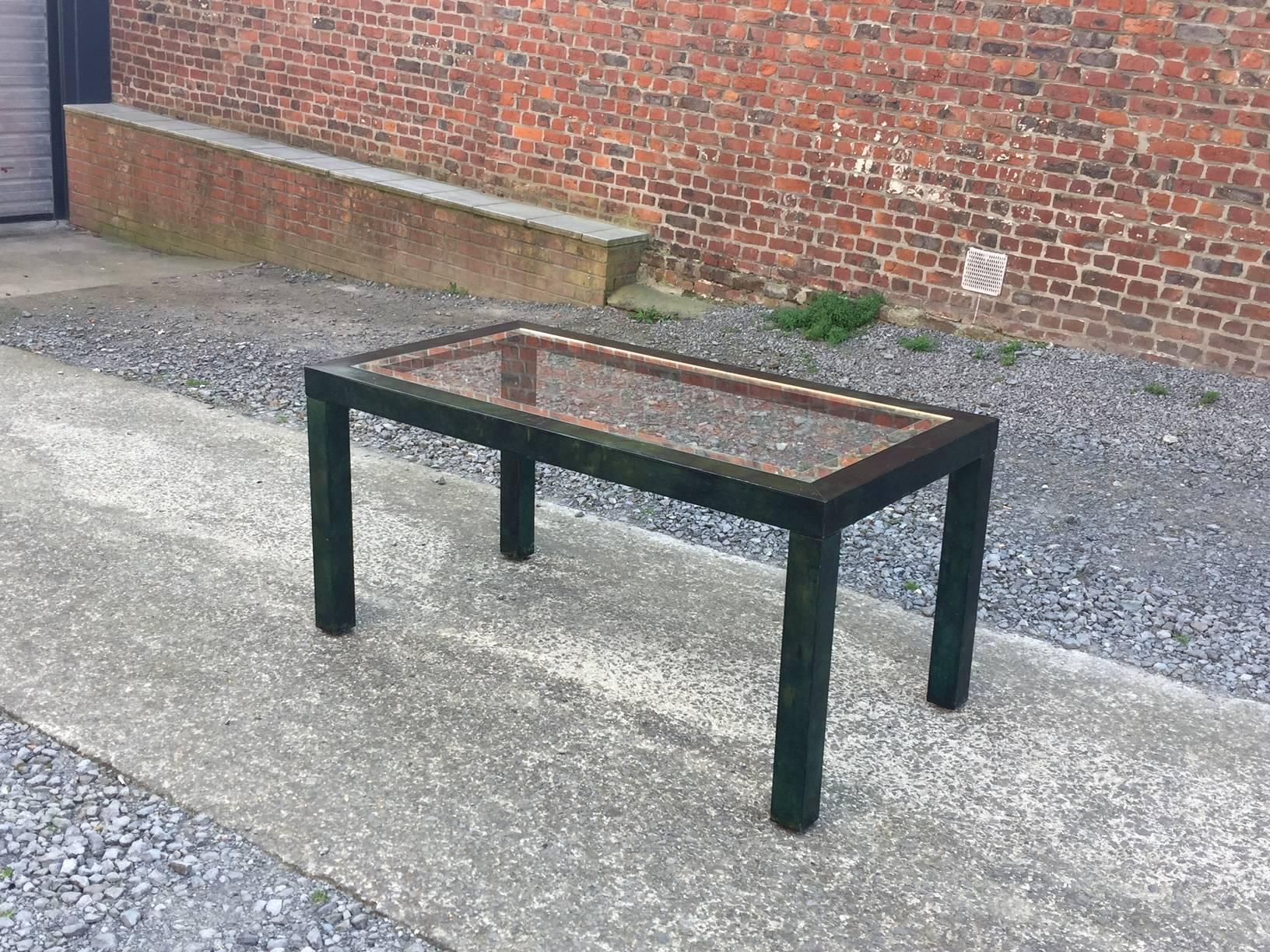 Aldo Tura lacquered parchment center or dining table.
Top in glass with mirror panel.
Wear of age and use on the mirror and in the leg.
  