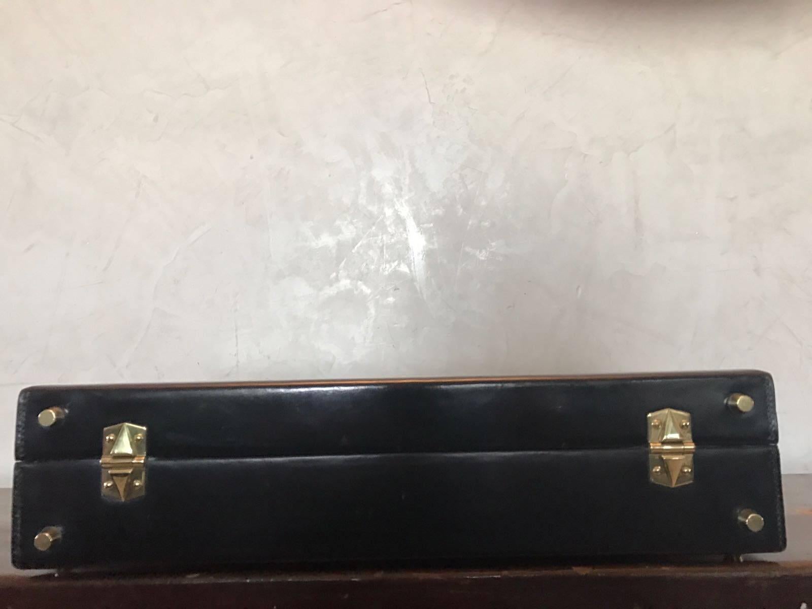 Hermès black leather and brass briefcase.