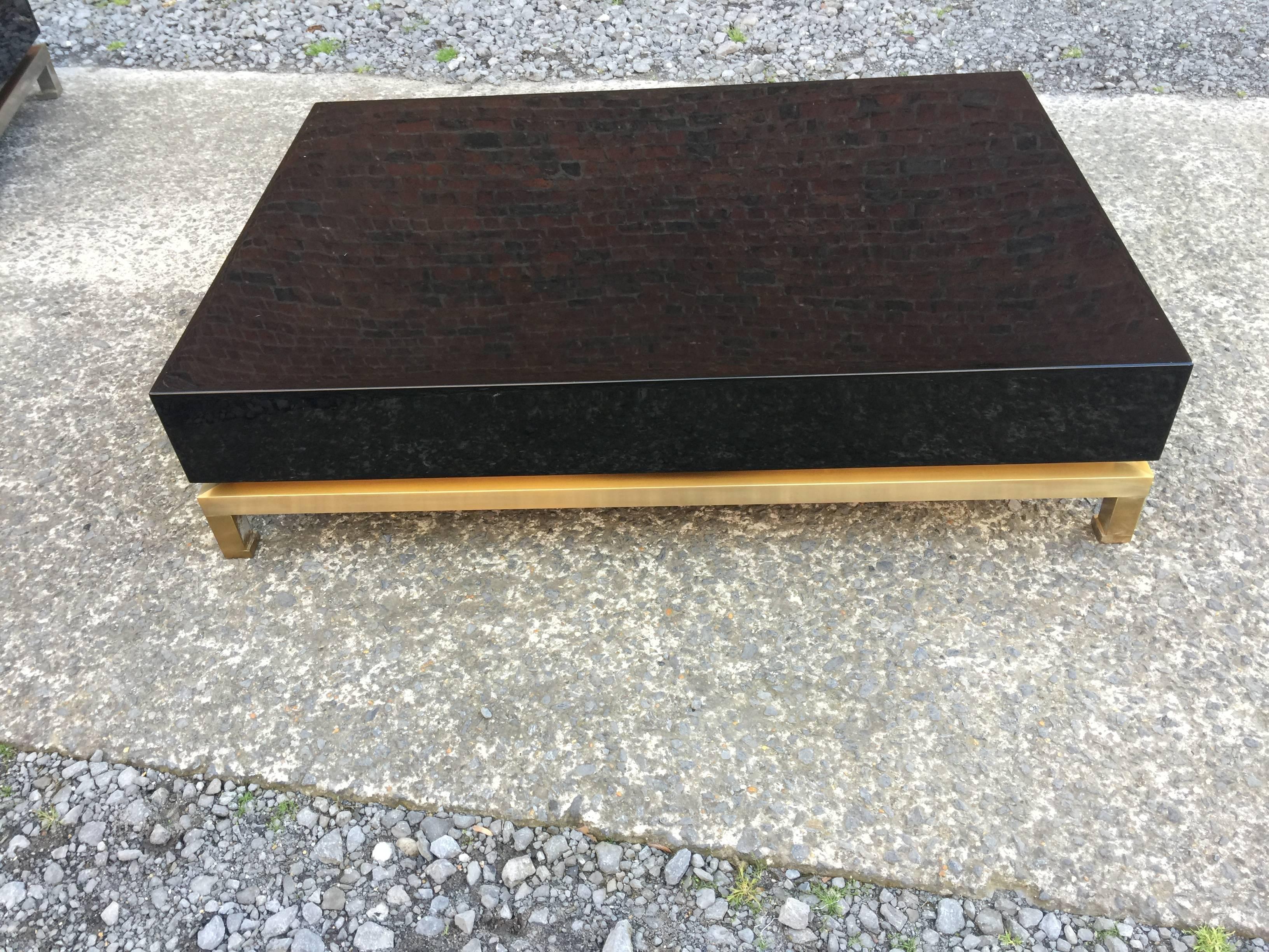 Guy Lefevre, large coffee table in brass and wood, Maison Jansen, circa 1970.
scratches of use.