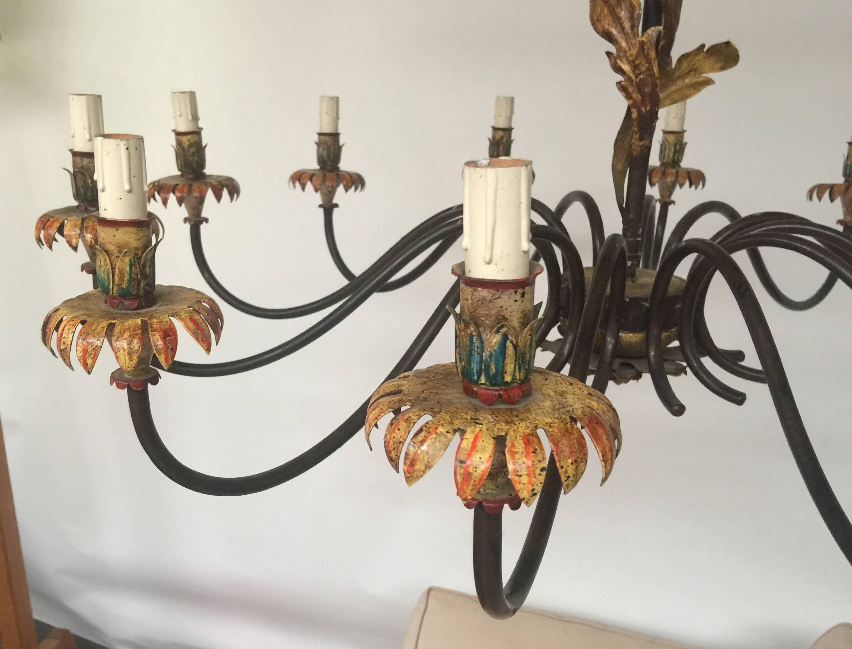 Twelve lights wrought iron chandelier
Neoromantic style, circa 1970.
Part of an important set including three sconces with five lights and nine sconces with two lights.