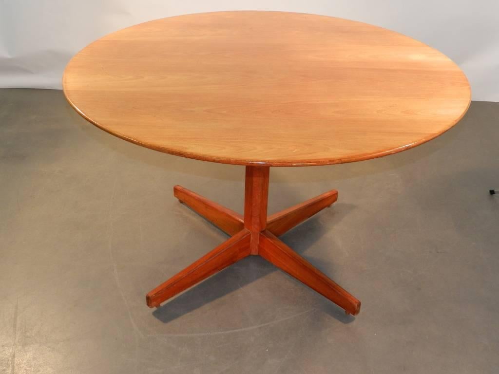 Elegant mahogany dining room table, circa 1960.