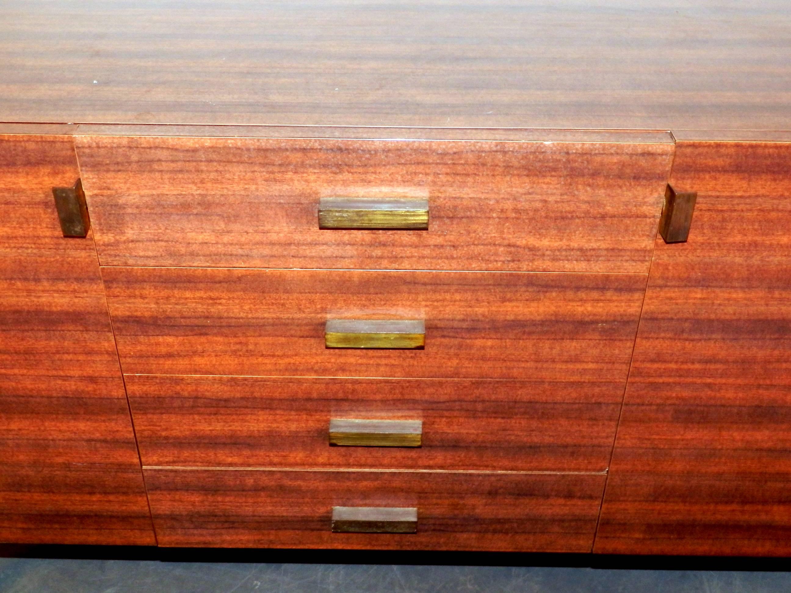 1950s sideboard in laminated wood in the style of A.R.P (Atelier de Recherche Plastique)
Handles in metal.