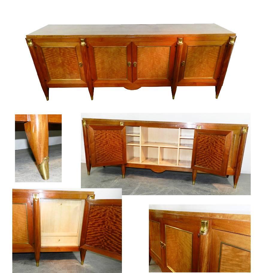 Maurice Jallot, luxurious Art Deco sideboard in Movingui moiré, circa 1940.
Inside in sycamore included a bar.
French varnish restauration quote on request.
 