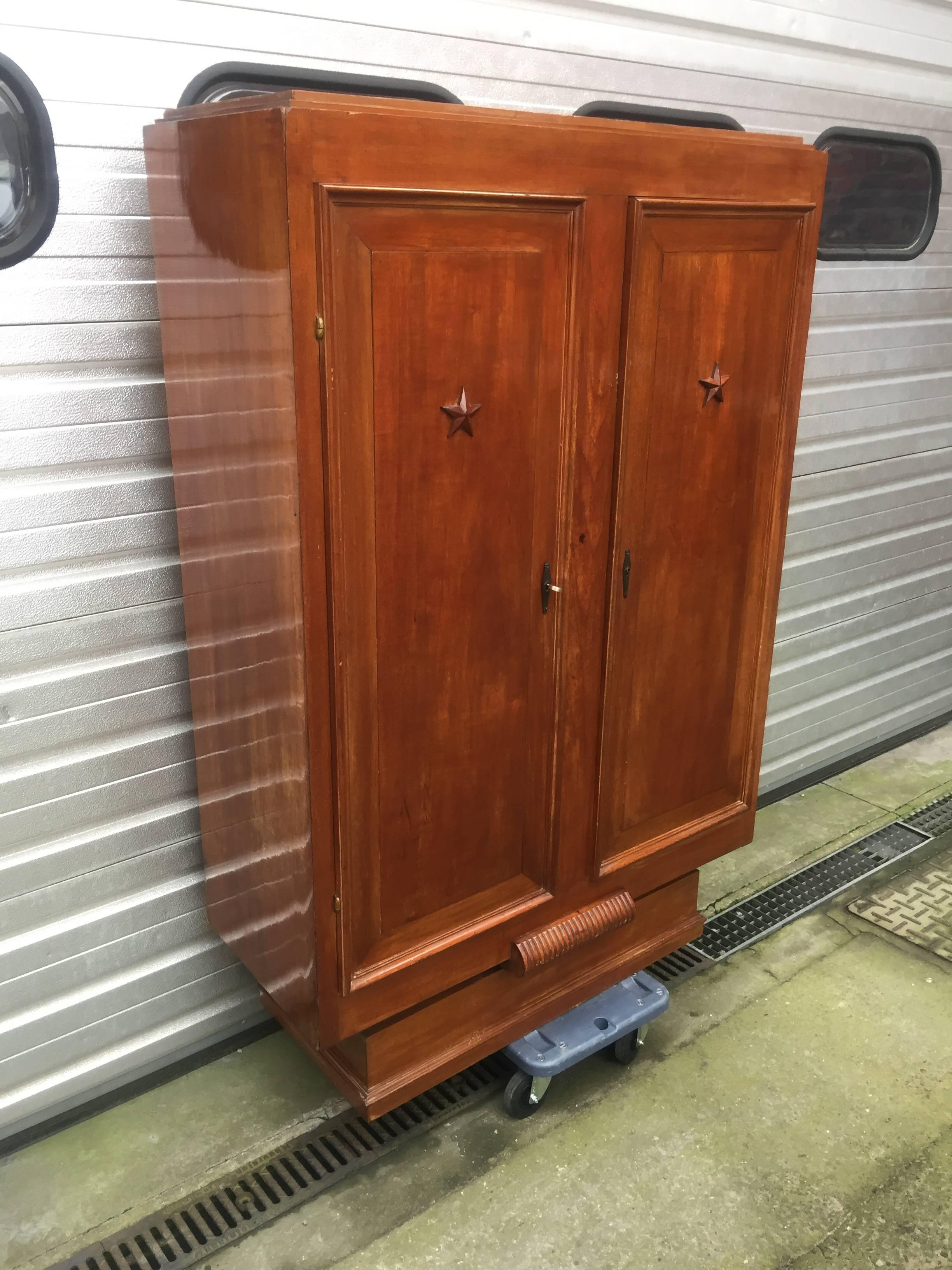 Art Deco mahogany cabinet in the style of Maxime Old.