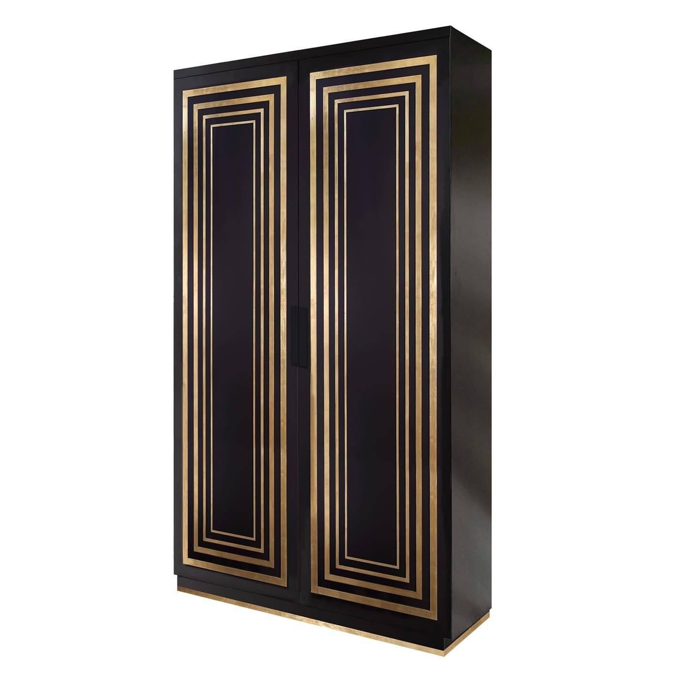 This two-door cabinet or wardrobe is the result of the finest Italian craftsmanship. Perfect for storing everything from books to dinnerware, it features four internal shelves and two doors overlaid with a hand-applied gold leaf detailing. The