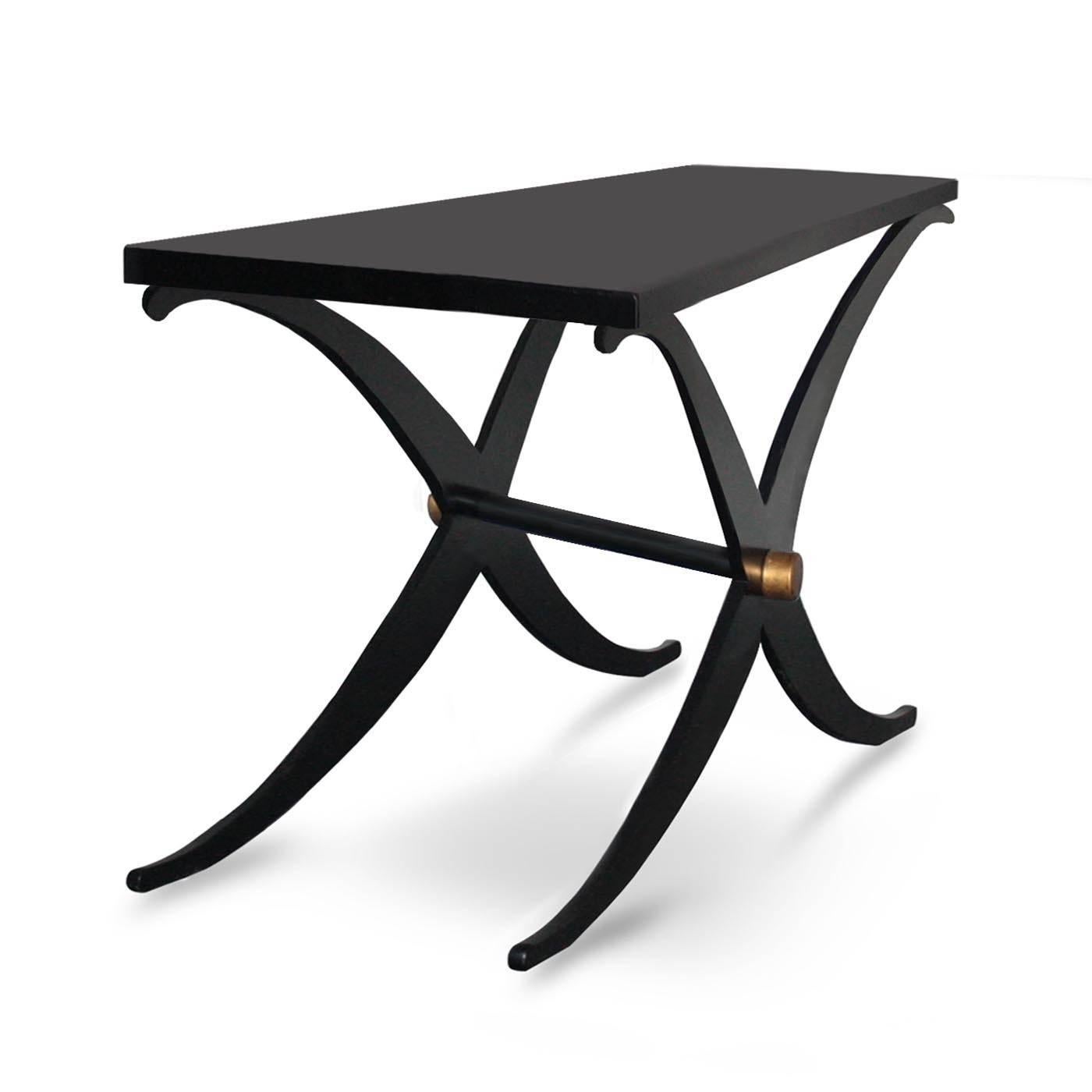 Crafted by expert Italian artisans, this console features a matte black lacquered tabletop supported by a metal cross-leg base with a gold leaf detail. It is a very versatile piece that is perfect for bar table, behind sofa but equally suitable for