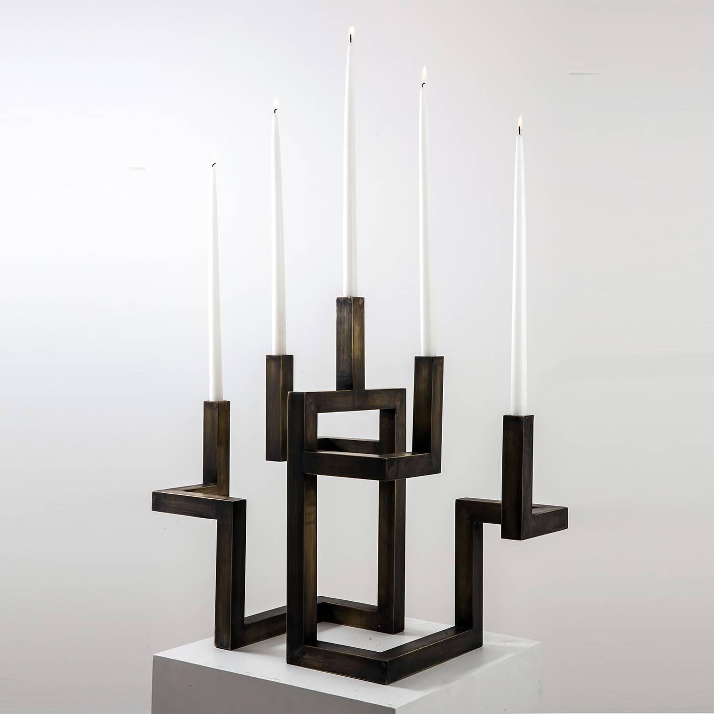 Five arms candelabra in bronzed brass entirely handmade in Italy by skilled artisans in the historical workshops of Rua Catalana in Naples. Its shape is a signature style by Neapolitan designer Francesco Della Femina, who conceived the piece as a a