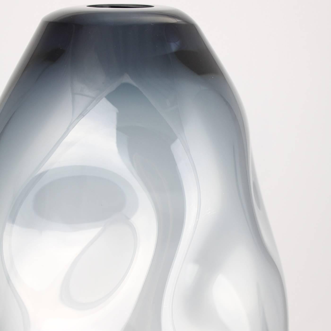 A unique piece mouth-blown by Murano legend Paolo Crepax, this vase has a delicate tinted shade and sinuous curves, all unique, since no piece can be identical to the other. Part of an exclusive series of 99 refined pieces, this vase is signed by