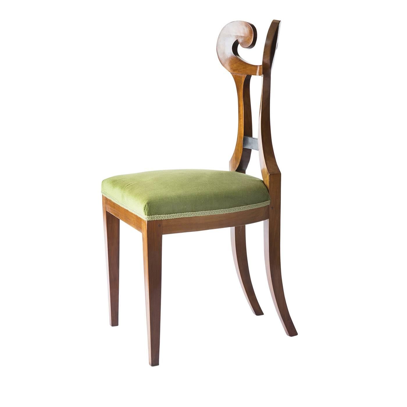 Wonderful set of four Biedermeier style seats made in solid cheerywood and finished with a veneering in the same wood and light green velvet for the seat. Each chair is fitted with trimmed finishes and a handmade polished shellac. The foam rubber