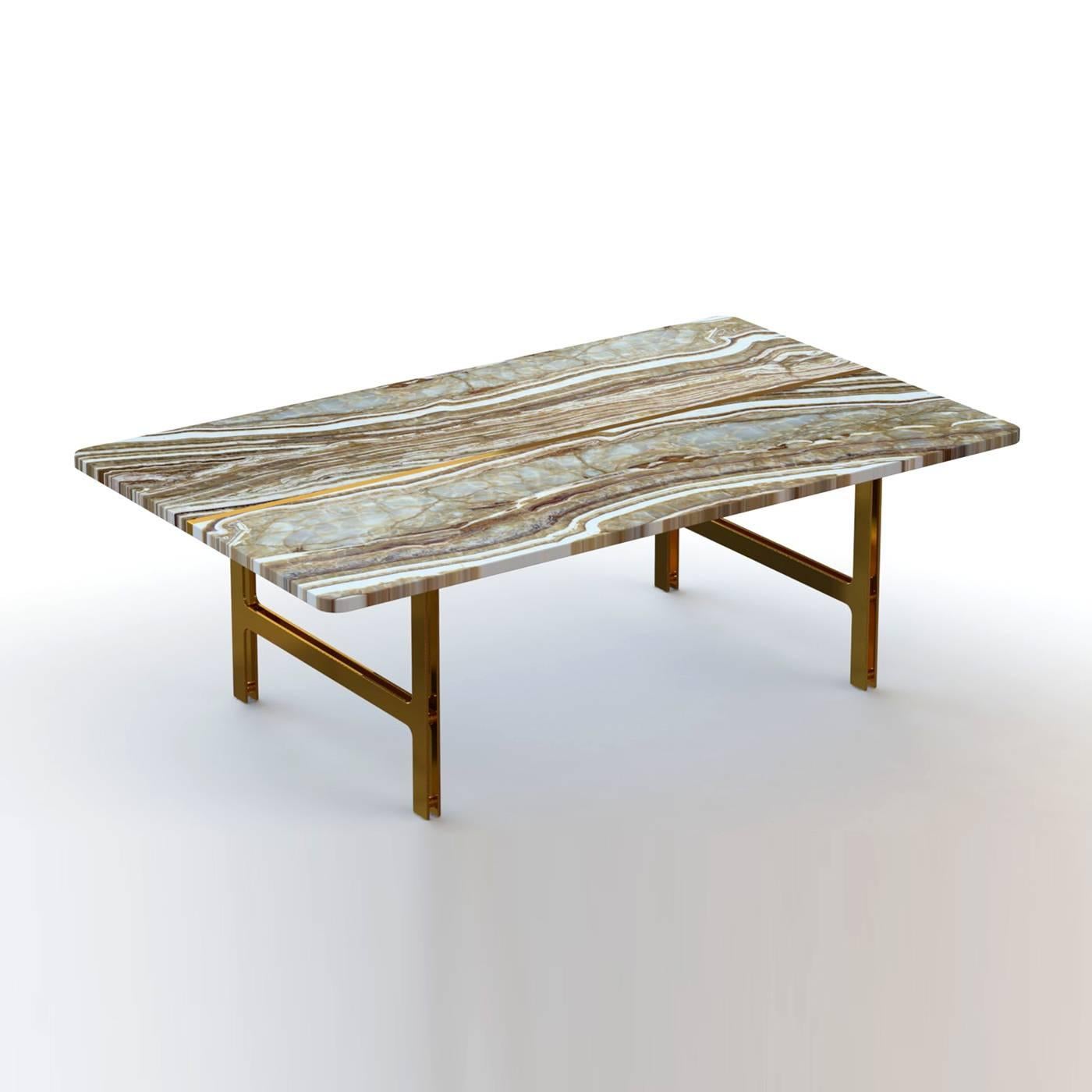 This elegant coffee table features a magnificent top comprised of two slabs of Italian tiger onyx with their striking veins that run vertically across the top, joined together with a brass element that accentuates the geometric silhouette of this