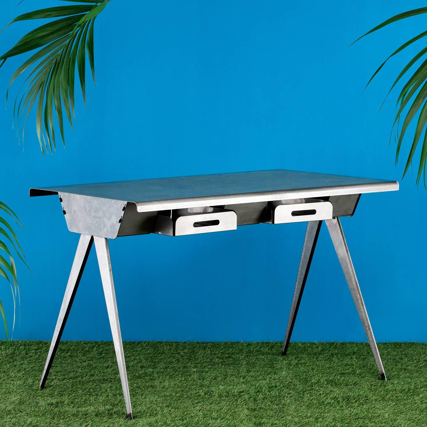 Elegance and functionality come together in this writing table. The delicate frame of this piece is crafted in sheets of steel and is fashioned with different folds forming the edges of the table's top and the two drawers that slide out from