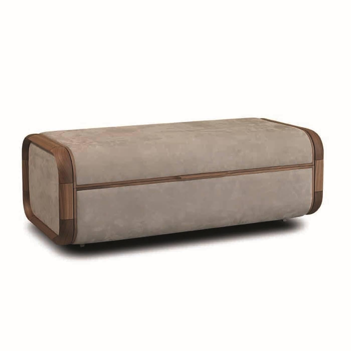 This elegant trunk is made entirely in walnut wood and its rectangular shape is rounded at the corners, the signature Ulivi style. Two leather panels with a strikingly complementing grey color upholster the top and bottom of the piece, covering also