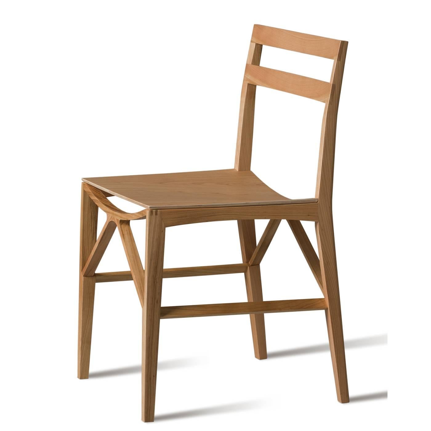 Clean lines, a light structure and geometric silhouettes characterize this elegant chair that is entirely made of wood and designed by Franco Poli. The unique structure that supports the seat is particularly striking because it builds a sort of a
