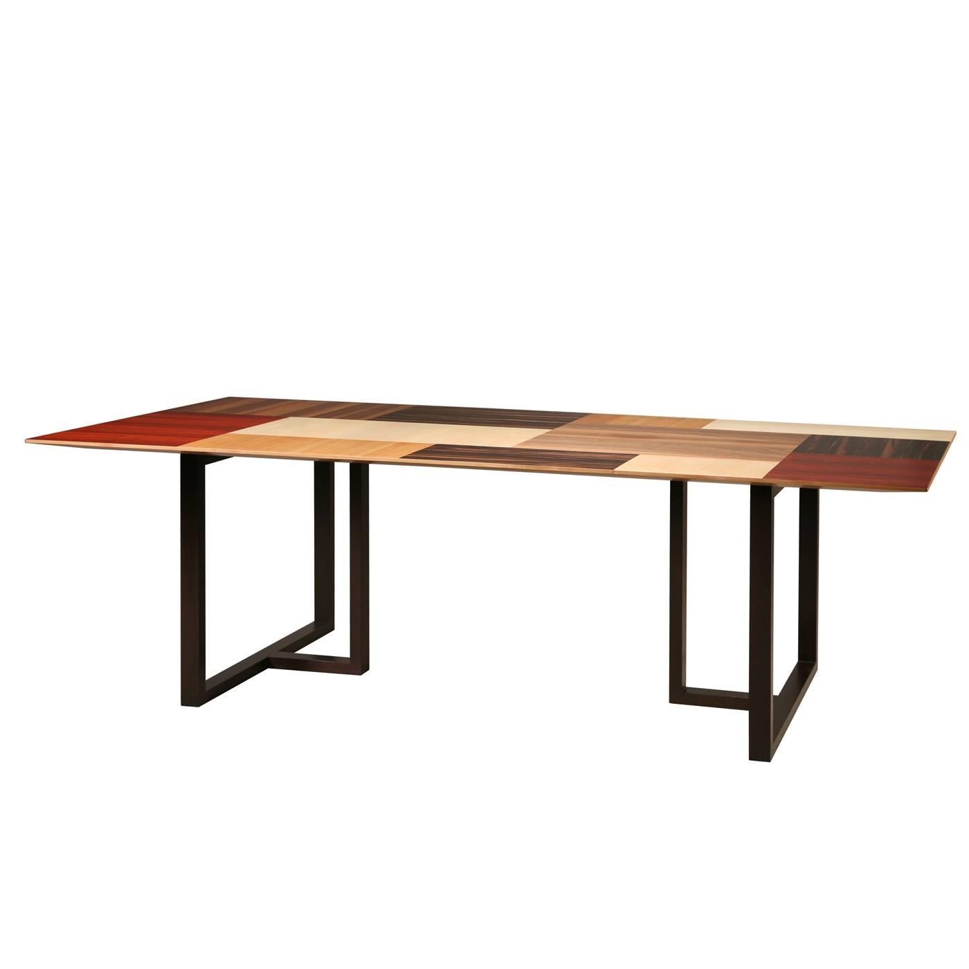 Part of the Patchwork collection designed by Maurizio Duranti for Morelato, this dining table features a top made of patches of different wood: wenge, walnut, maple, padauk, ebony, and cherry. The result is a playful piece that will make a modern