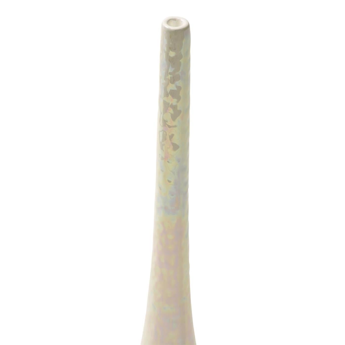 This candlestick is a sophisticated modern décor piece by Ceramica Gatti. After the molding and the first firing, the maiolica is hand-painted in pearl white, and then fired for the second time. The piece is finished with a mother-of- pearl luster