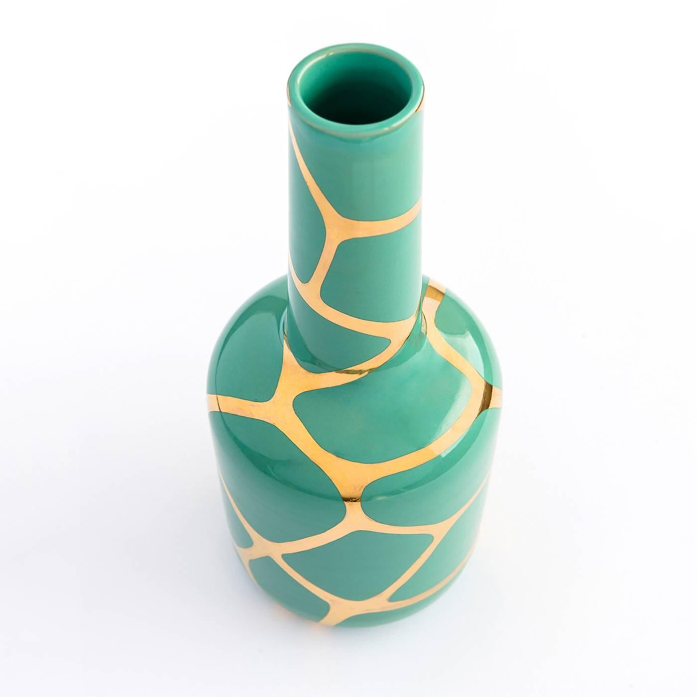 Luna is a ceramic vase made on a lathe and hand-painted by the skilled ceramists of Ceramiche Gatti in Faenza. The design follows a pattern of green geometrical shapes, such as rectangles, triangles and trapezoids on pure gold and aqua enamel.


  