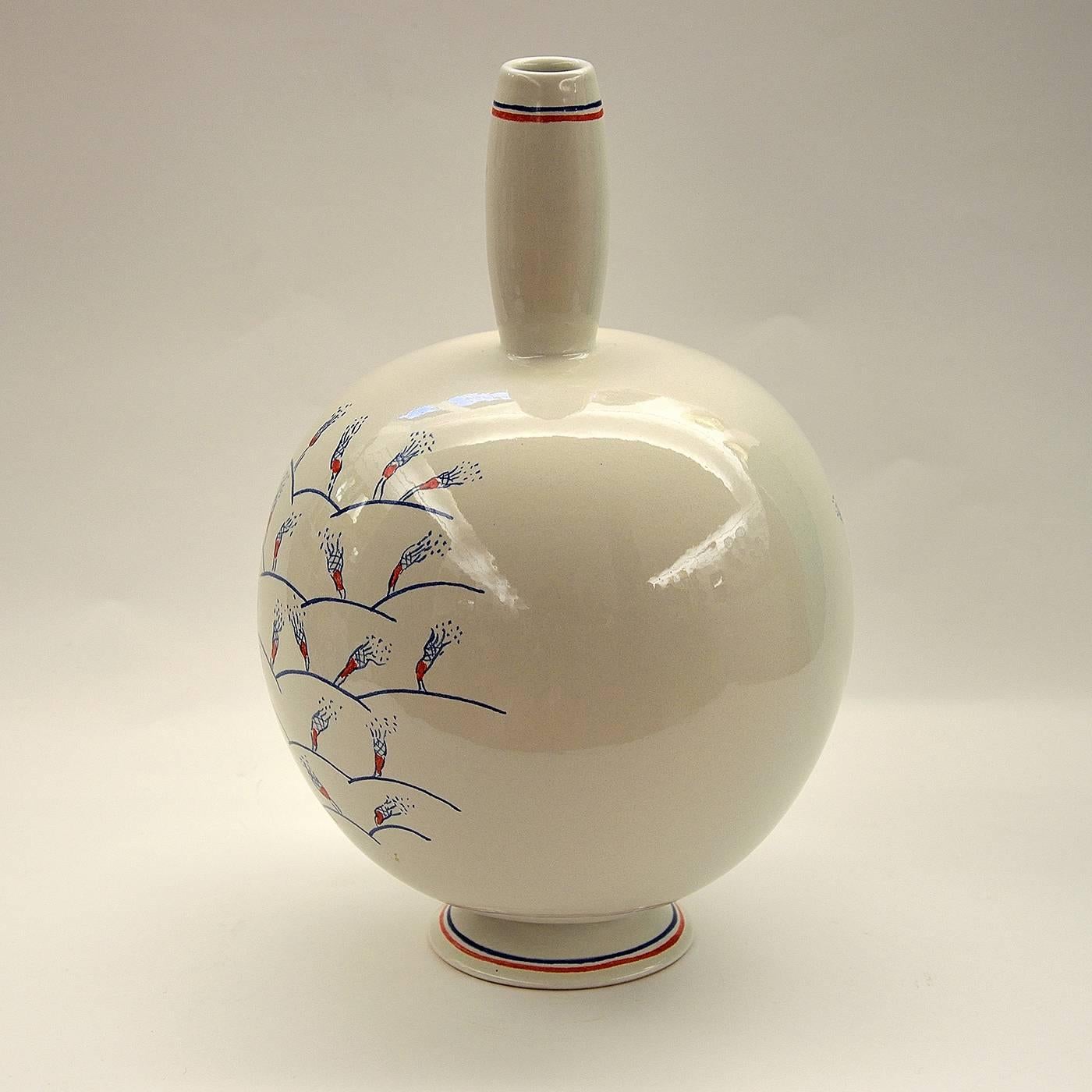 This ceramic vase was made on a lathe and enameled in earthenware. The whimsical pattern on the vase was hand-painted in blue and red over a shiny white base. This piece is one in a limited series of six crafted by Ugo La Pietra.