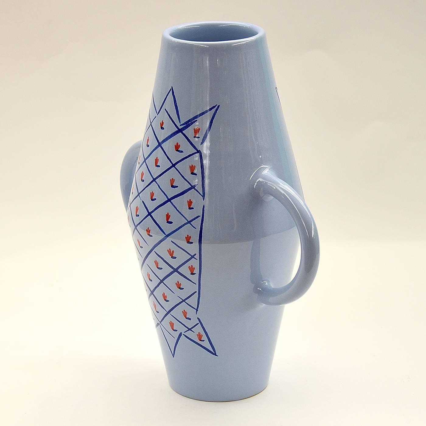 This ceramic vase with handles was made on a lathe and enameled in earthenware. It was hand-painted with a geometric pattern in blue and red over a light blue glossy base. This piece is one in a limited series of six crafted by Ugo La Pietra.