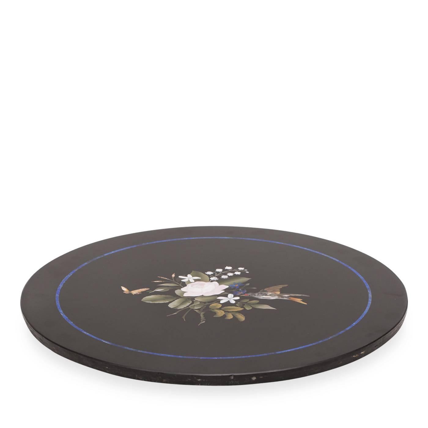 This is a Florentine mosaic table in black Belgian marble with inserts of lapis lazuli and other semi-precious stones. The Azul mosaic table is one of the rarest pieces by Traversari Mosaici for its extraordinary floral detail.