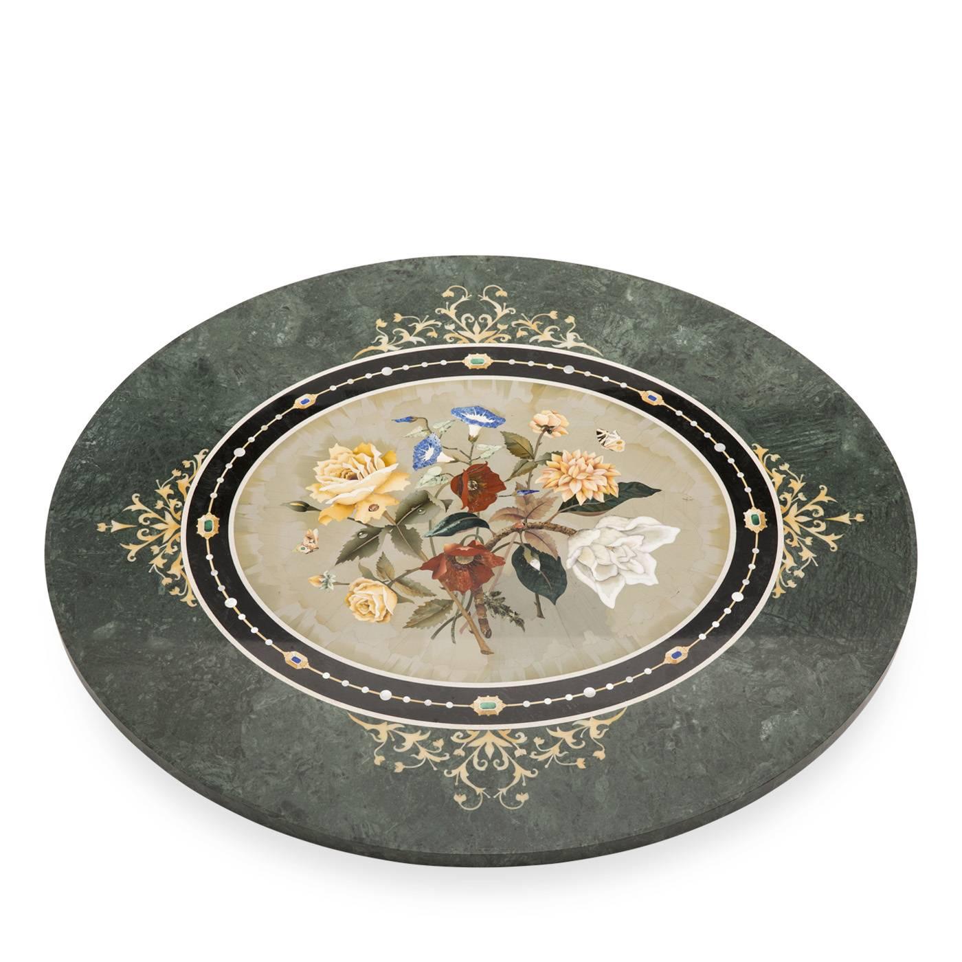 The Traversari brothers demonstrated their stunning craftsmanship in this Florentine mosaic table for which were used green jasper, different semi-precious stones, and pearls. The hand-carved wooden base, gilded with 23.75-karat gold leaf, combines
