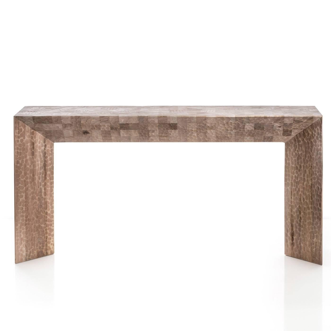 The solid Italian walnut wood of this table is hand-carved with a plane and gouge. The result is a Minimalist object made of three lines that evoke both the density and the substance of the matter they are made of.

