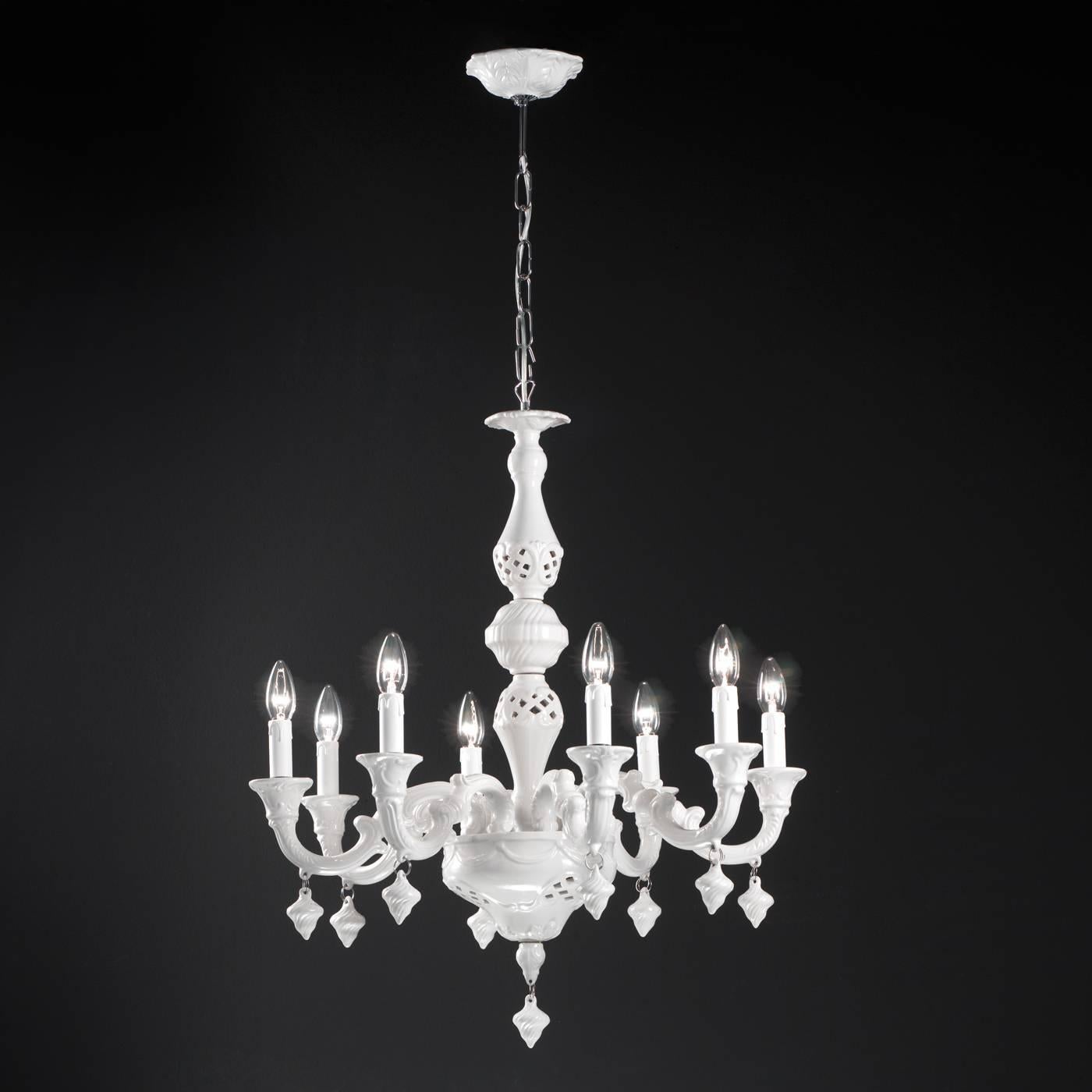 This elegant chandelier was crafted entirely by hand in ceramics and then covered in a premium opaque white glaze. This piece is of a smaller size perfect for the illumination of smaller spaces. Eight arms sinuously curve outward, each one holding a