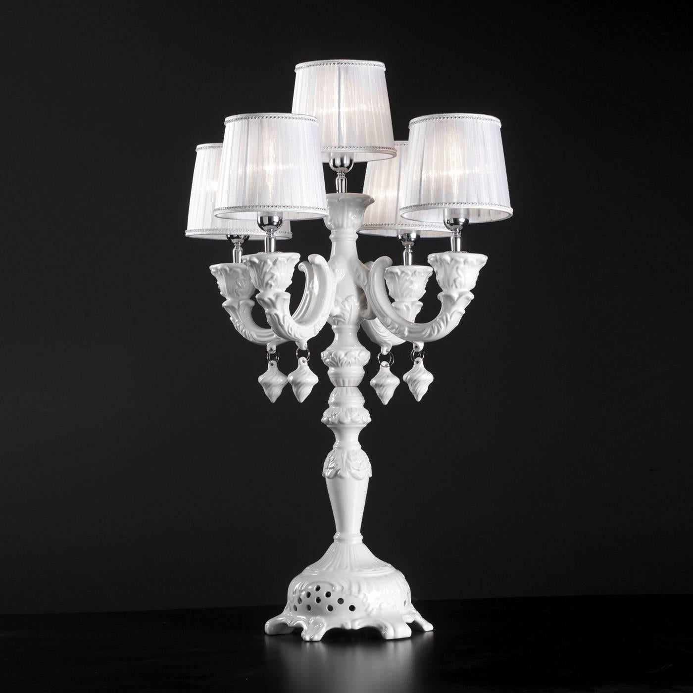 This exquisite lamp is ideal to be placed on large tables beautifully illuminating a room. The elegant shapes and perfect proportions make this piece a luxurious and unique object. The decorative opaque white ceramic lamp, featuring a candelabra